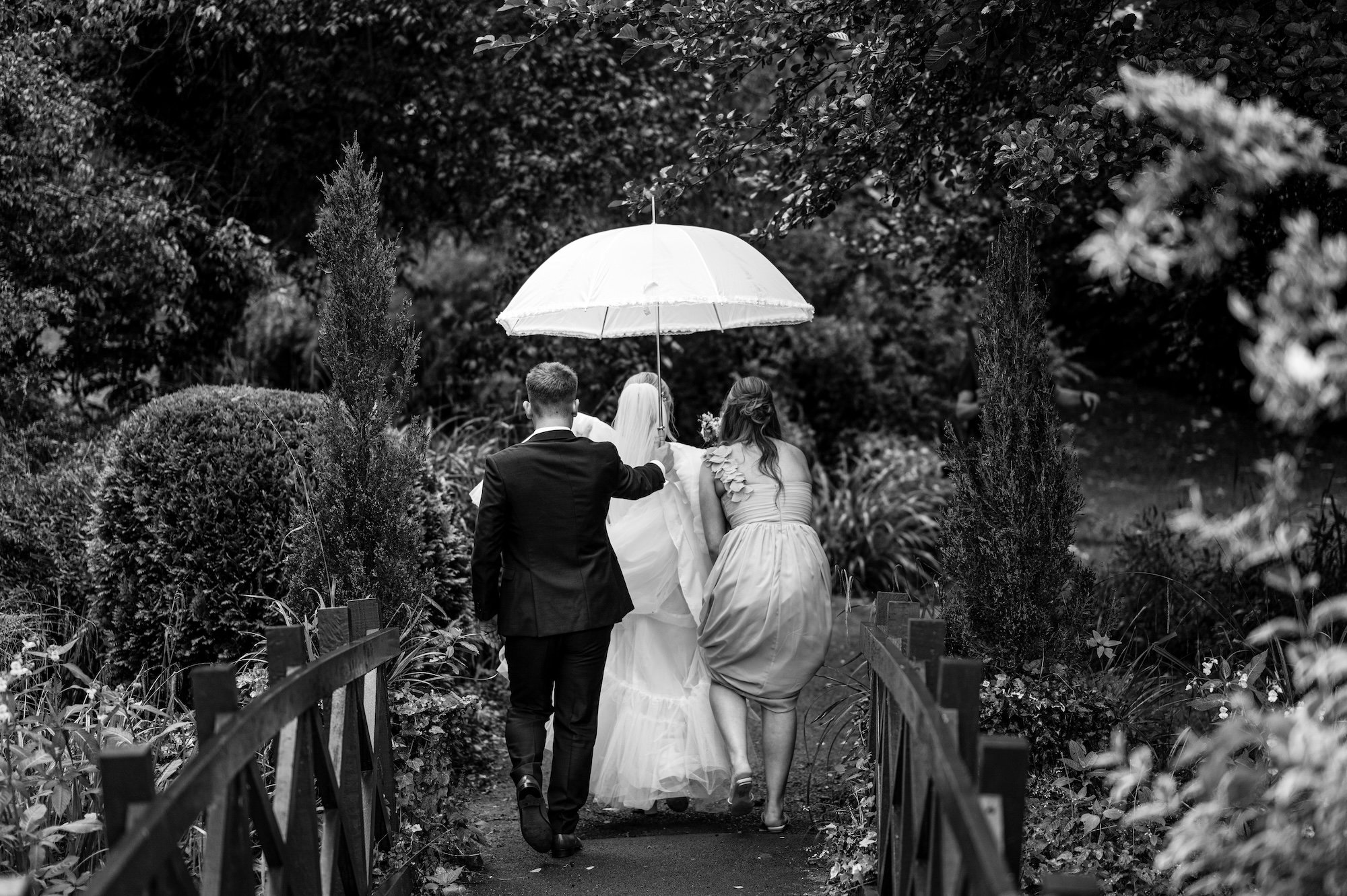 Sophie and Sam in the rain at The Mill Barns Wedding Venue