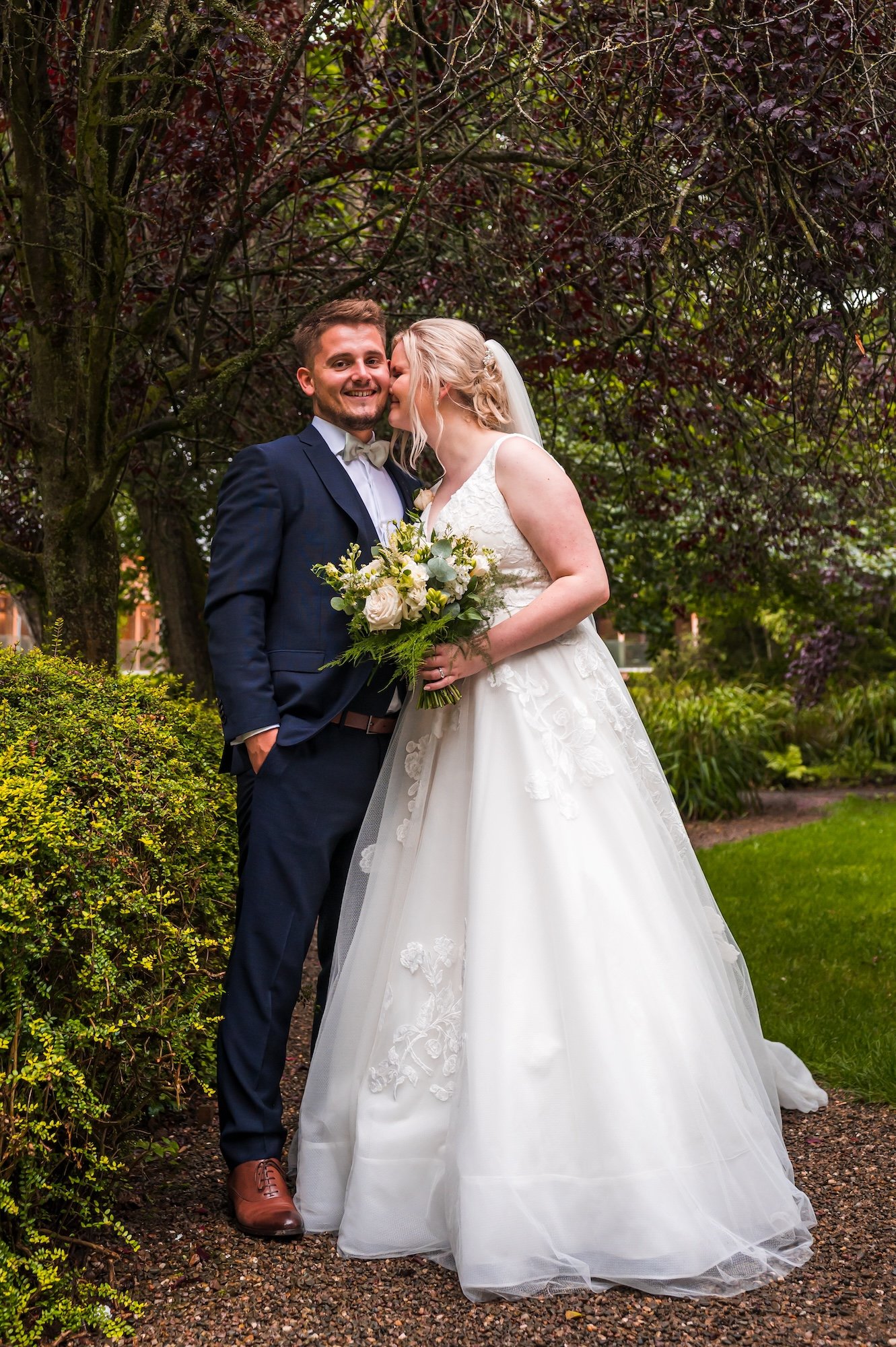 Sophie and Sam in the garden at The Mill Barns Wedding Venue
