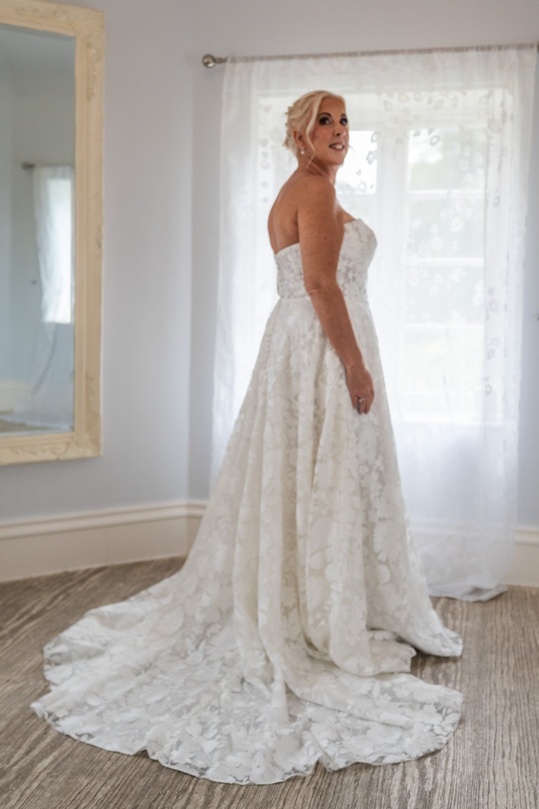 Portrait of bride looking over her shoulder