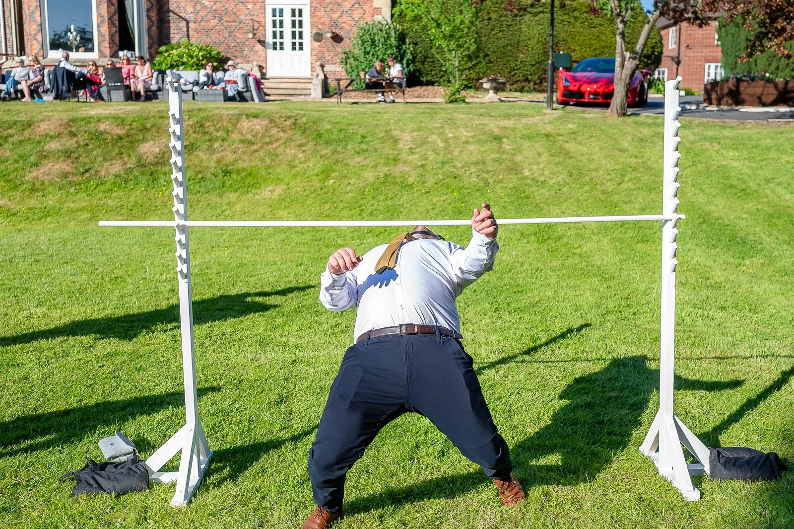 Wedding guest does the limbo dance