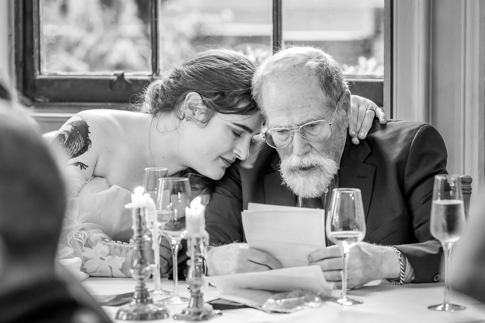 Bride hugs her father just after his speech