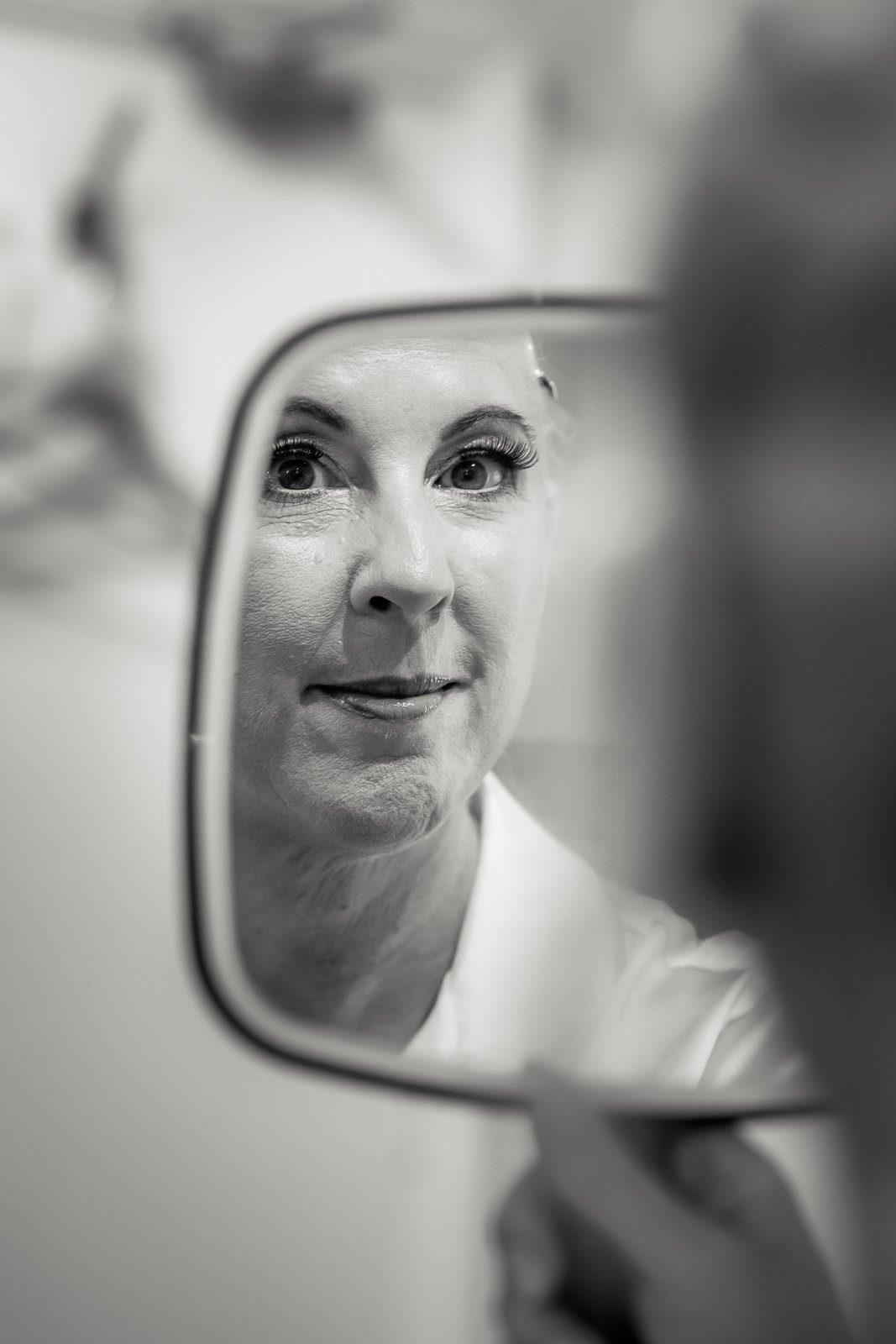 Reflection of bride in a mirror