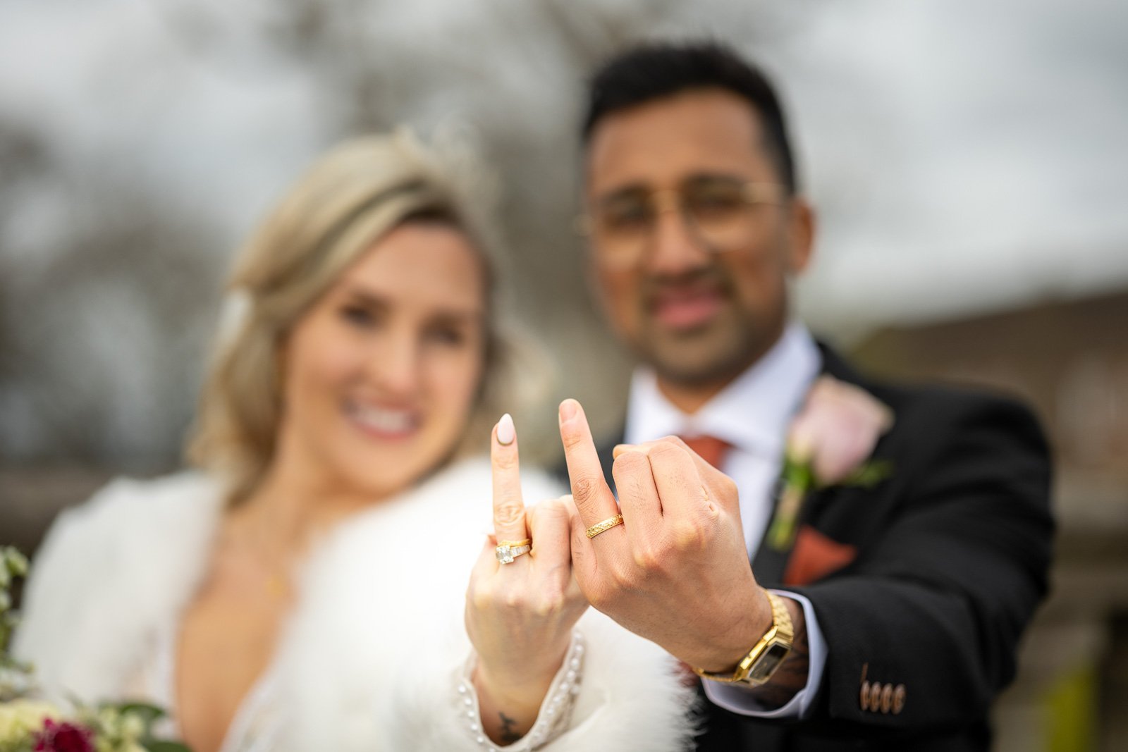 Couple show off their wedding rings