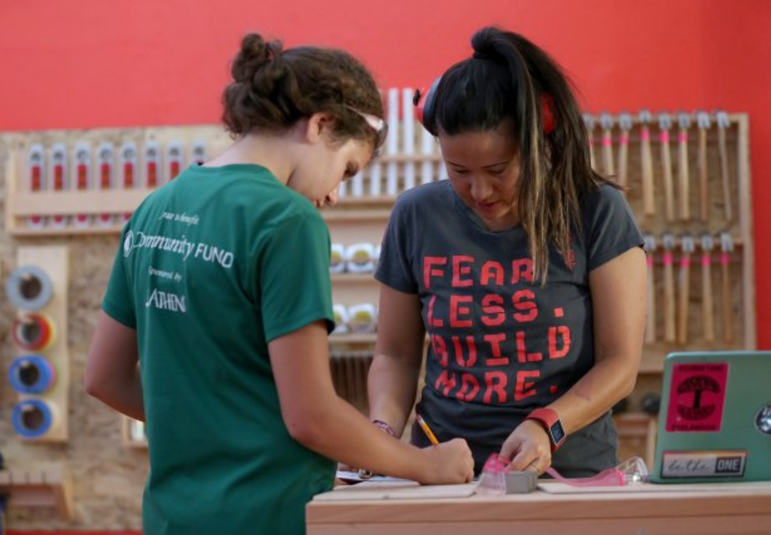 Founder Emily Pilloton with a student: "Fear Less. Build More."