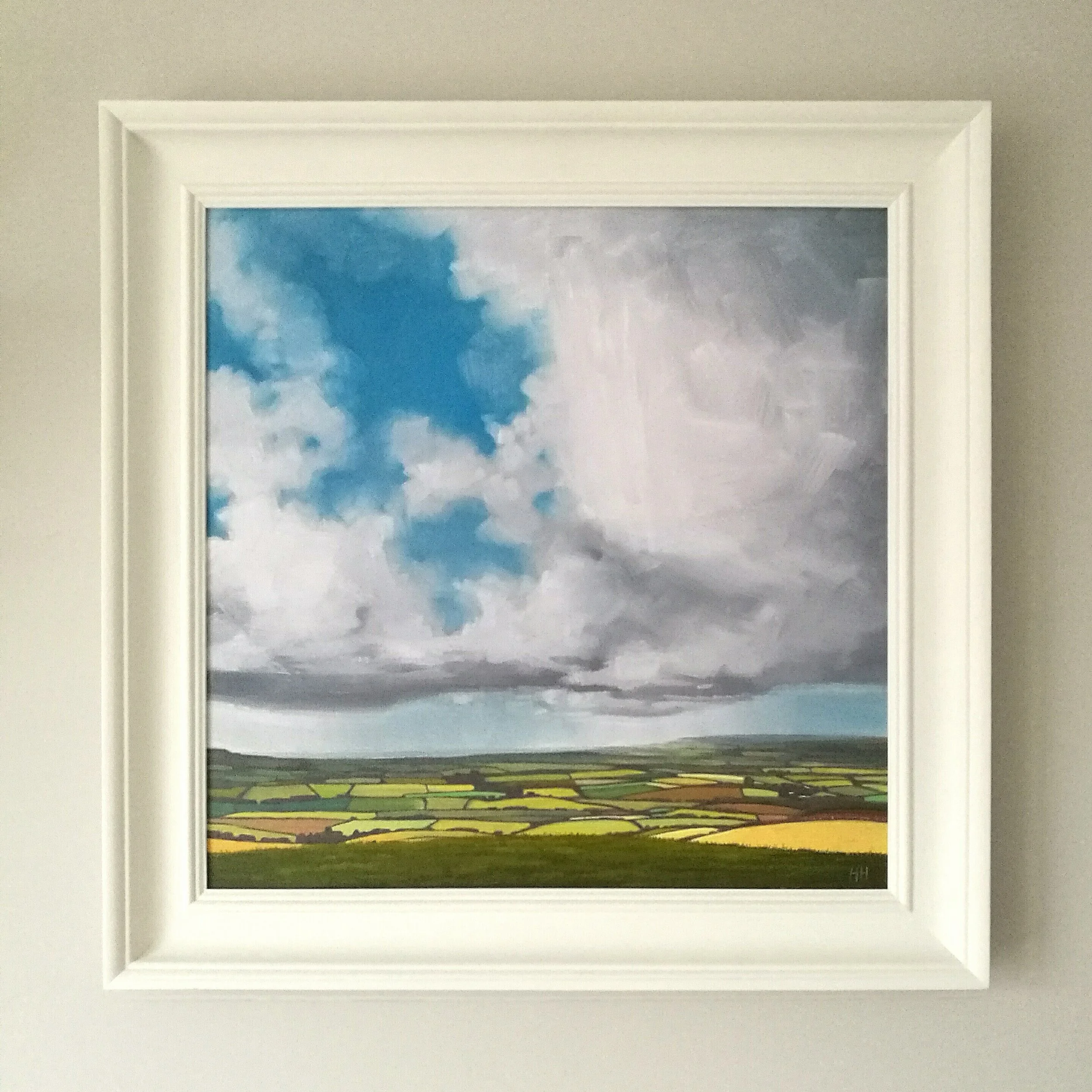 mottistone painting in white frame on wall v1.jpg