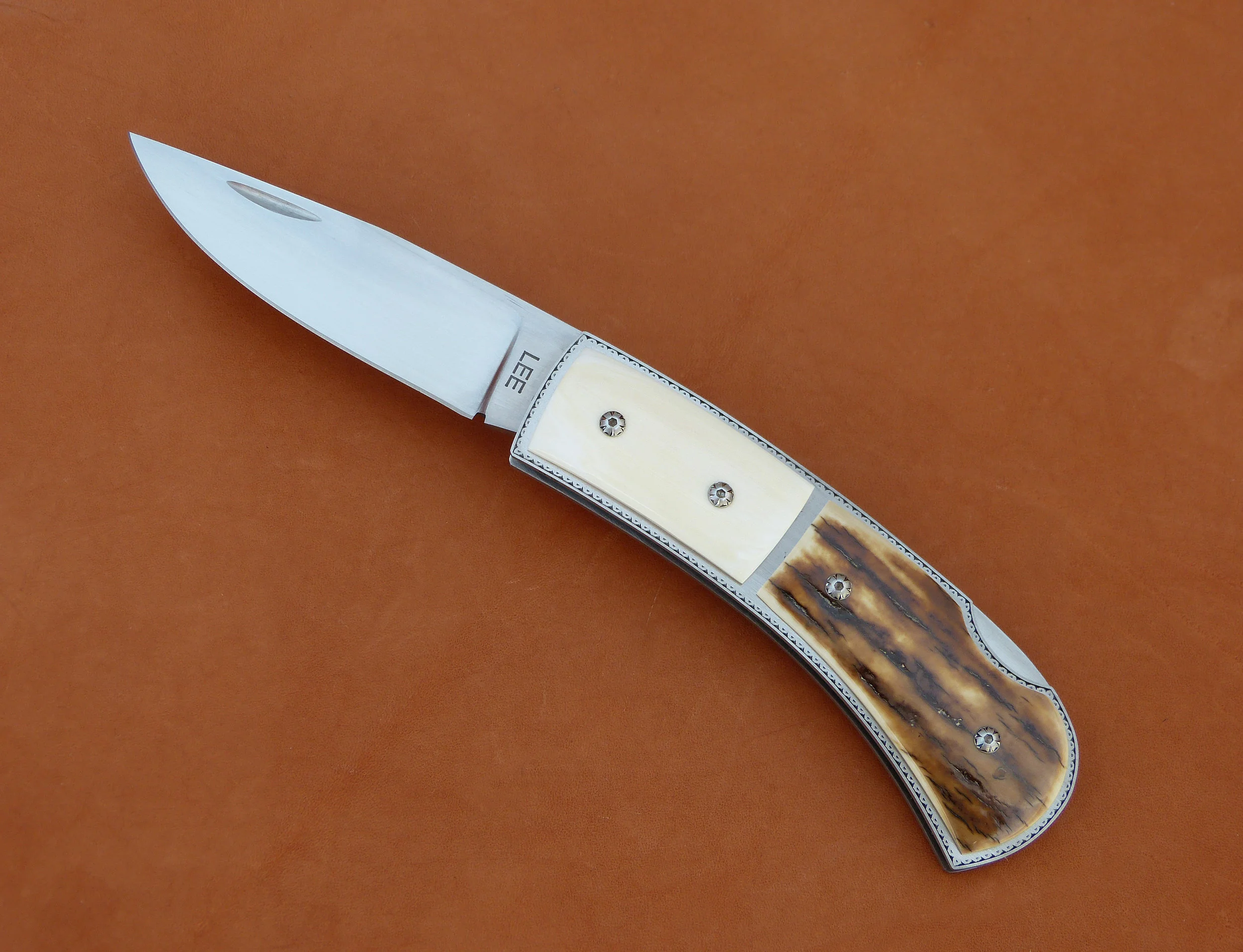 Tommy Lee lock back folder. SOLD