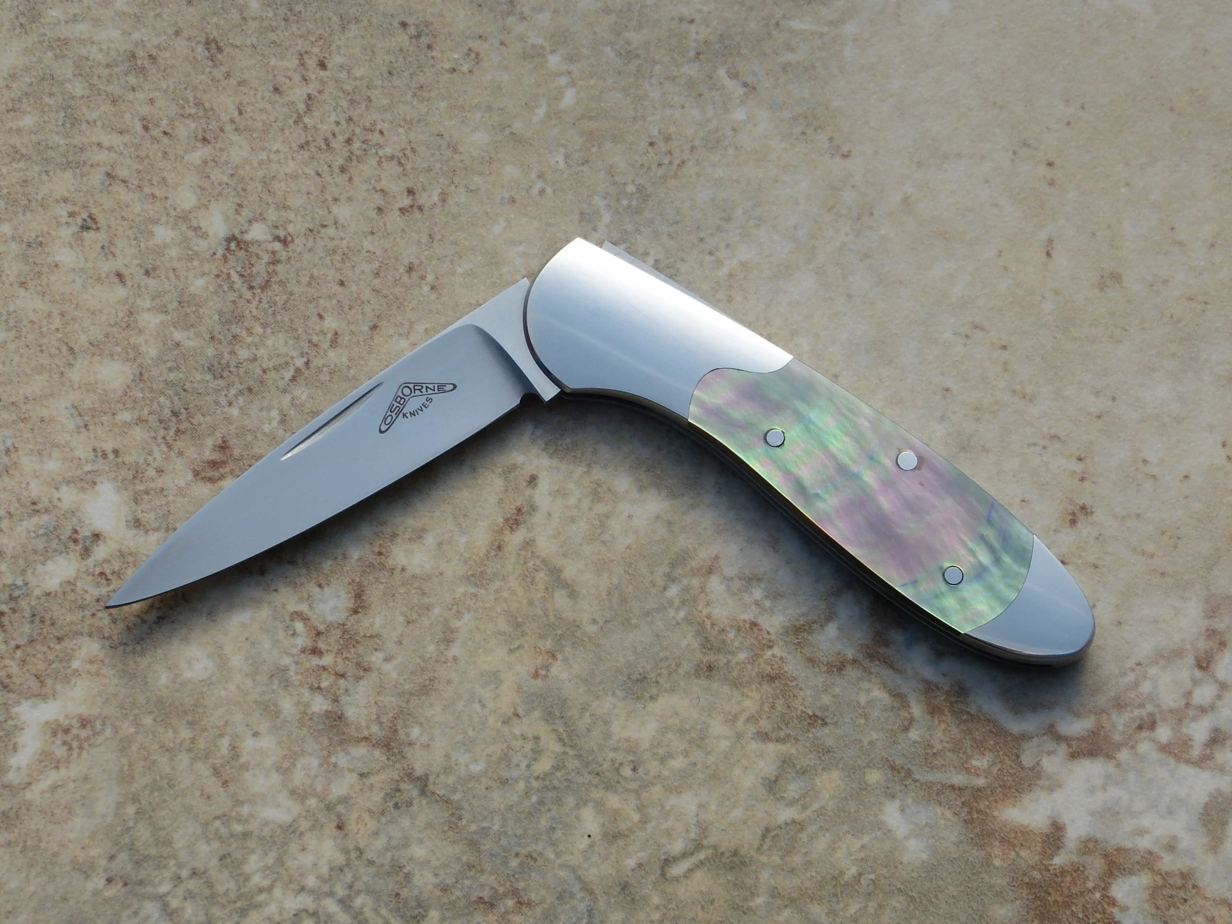 Warren Osborne (deceased). Slip joint integral folder. Black lip pearl. SOLD