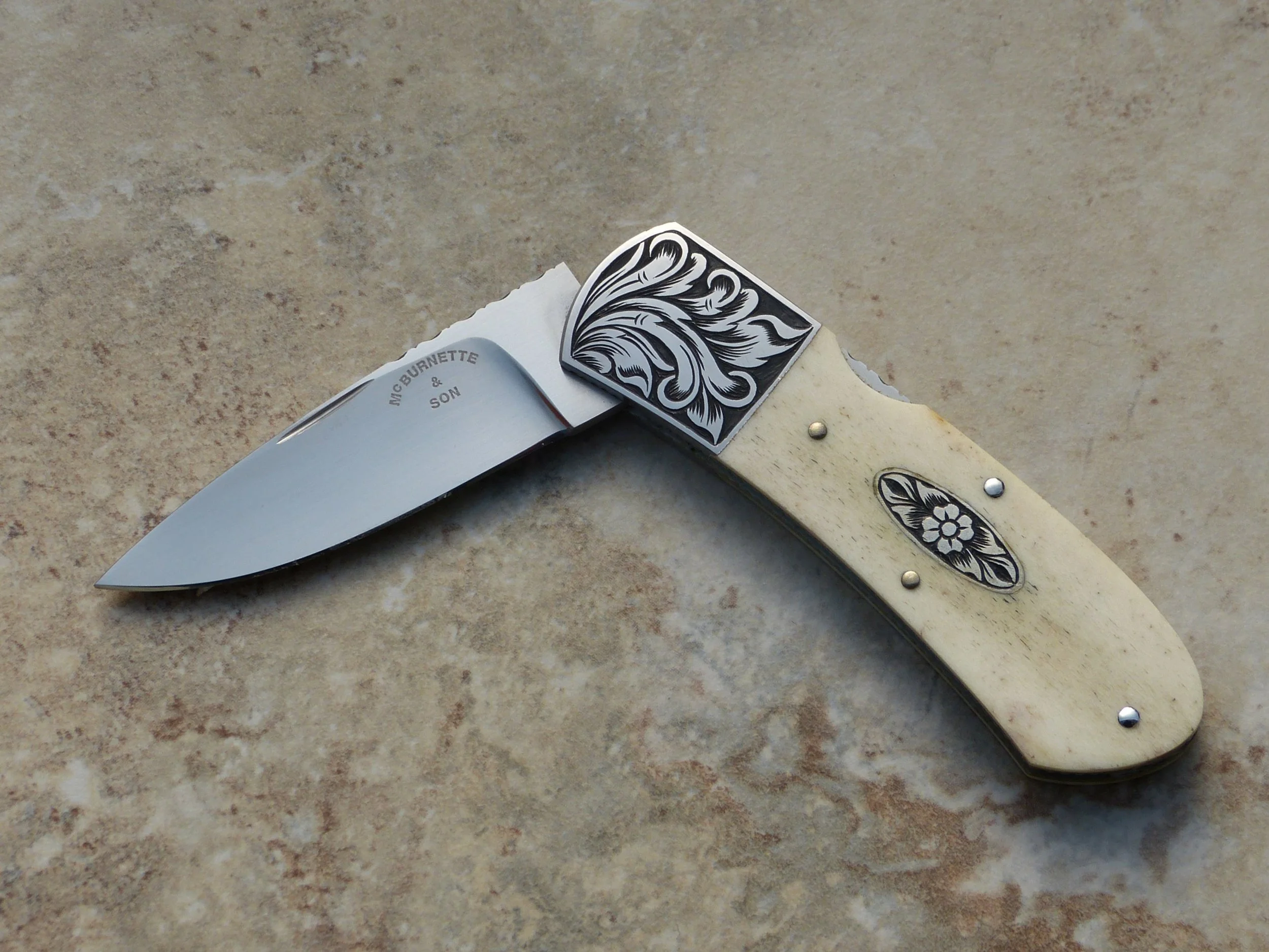 Harvey McBurnette (deceased). Engraved front lock folder. SOLD