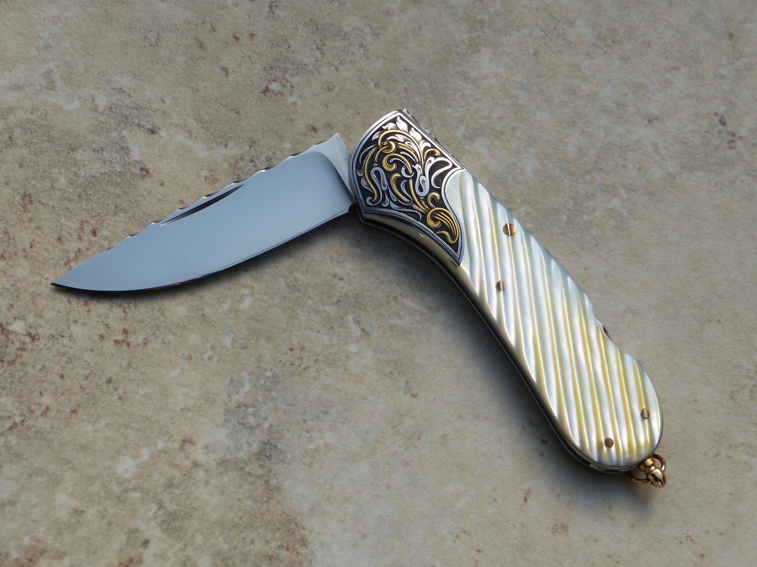 Joe Kious lock back gold lip pearl folder. Warenski Engraving. SOLD