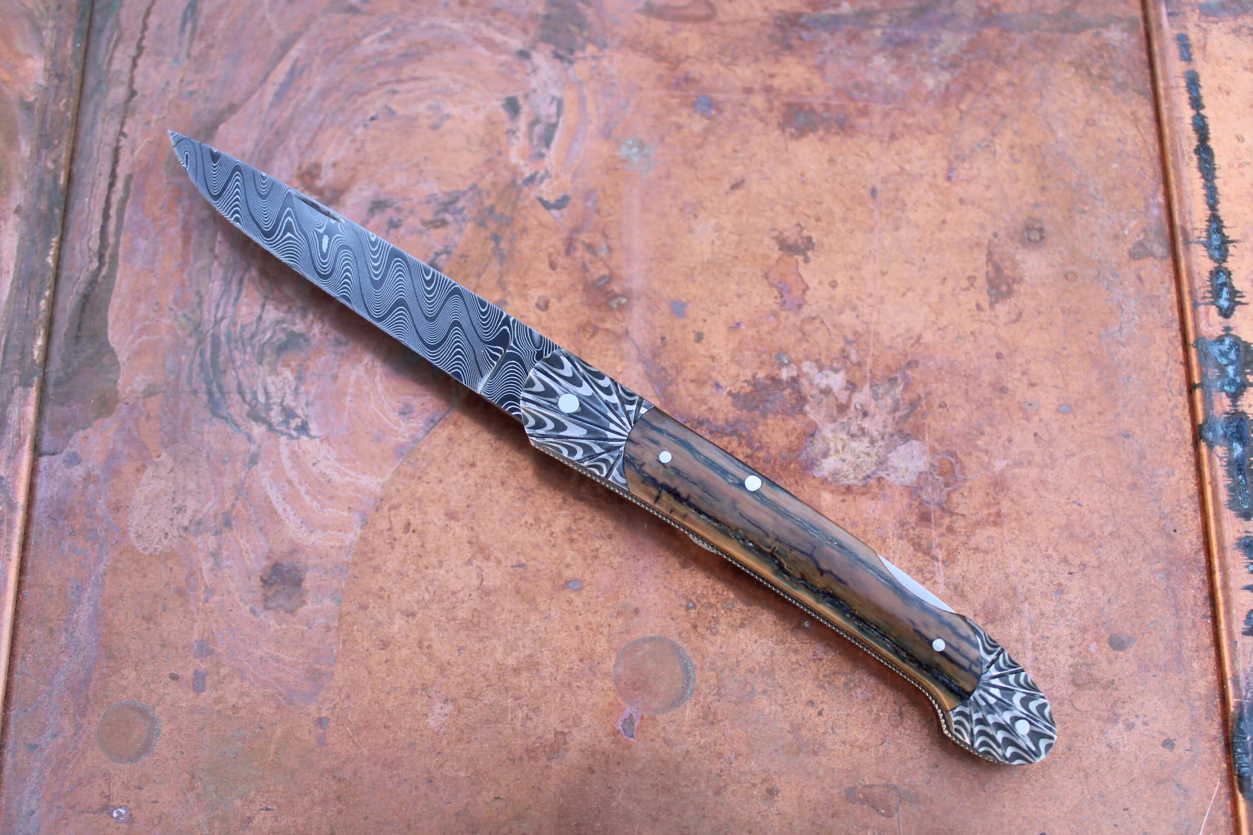 KEN STEIGERWALT DAMASCUS LOCK BACK FOLDER. SOLD