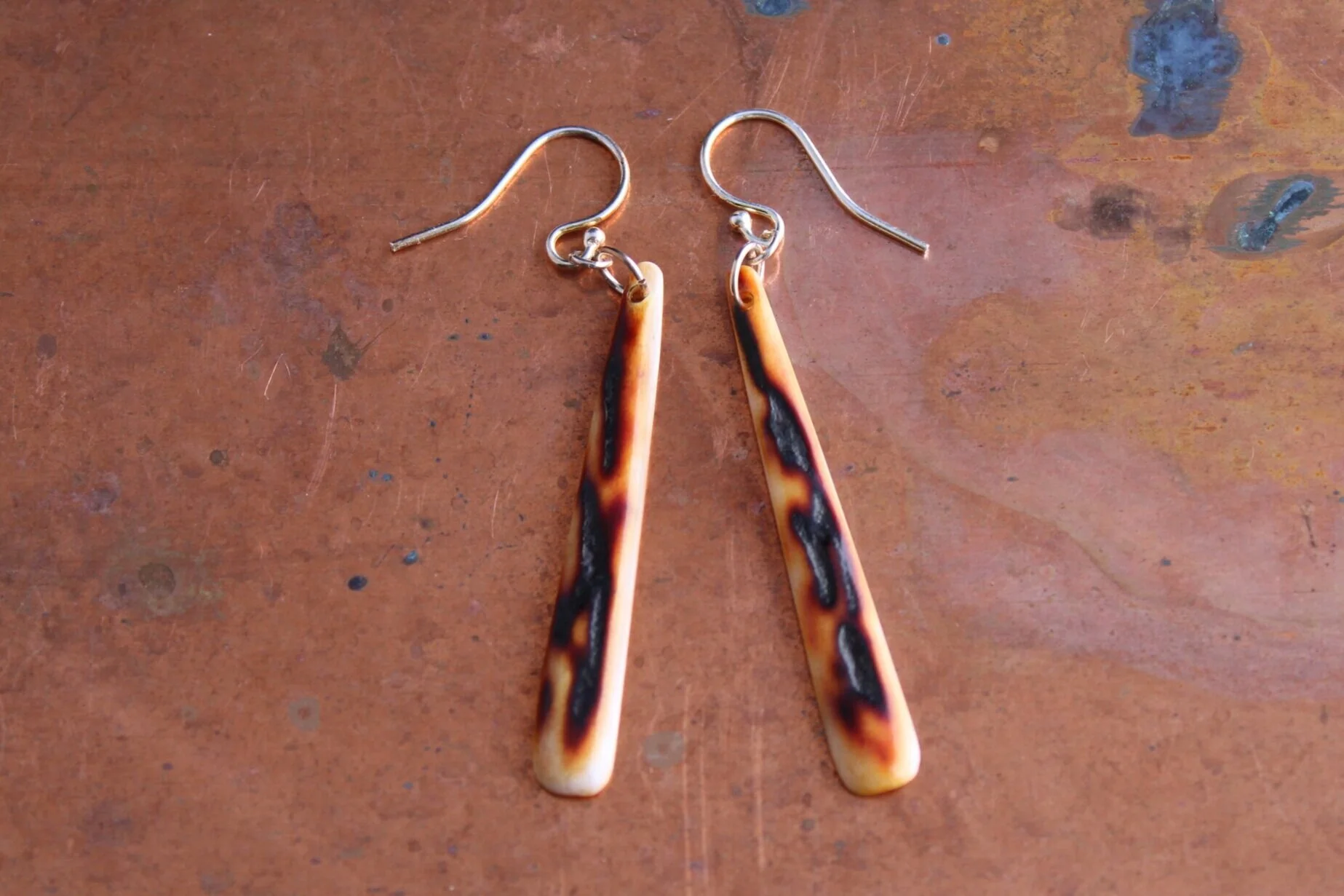 Amber stag pendant earrings. $125