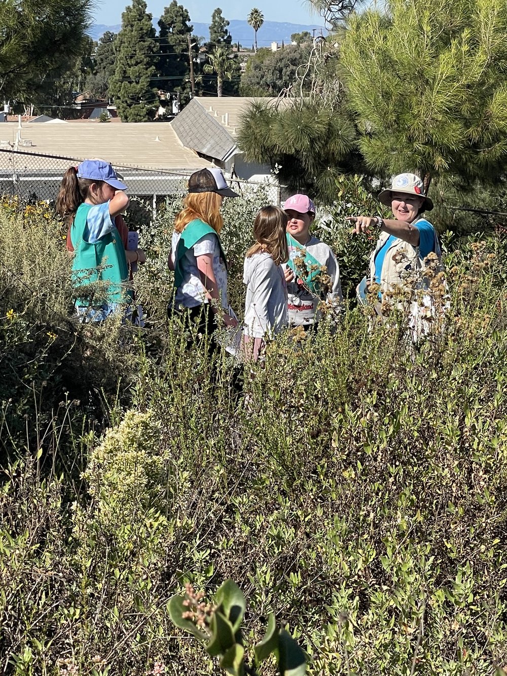 Mary addresses girl scouts during Nature Walk