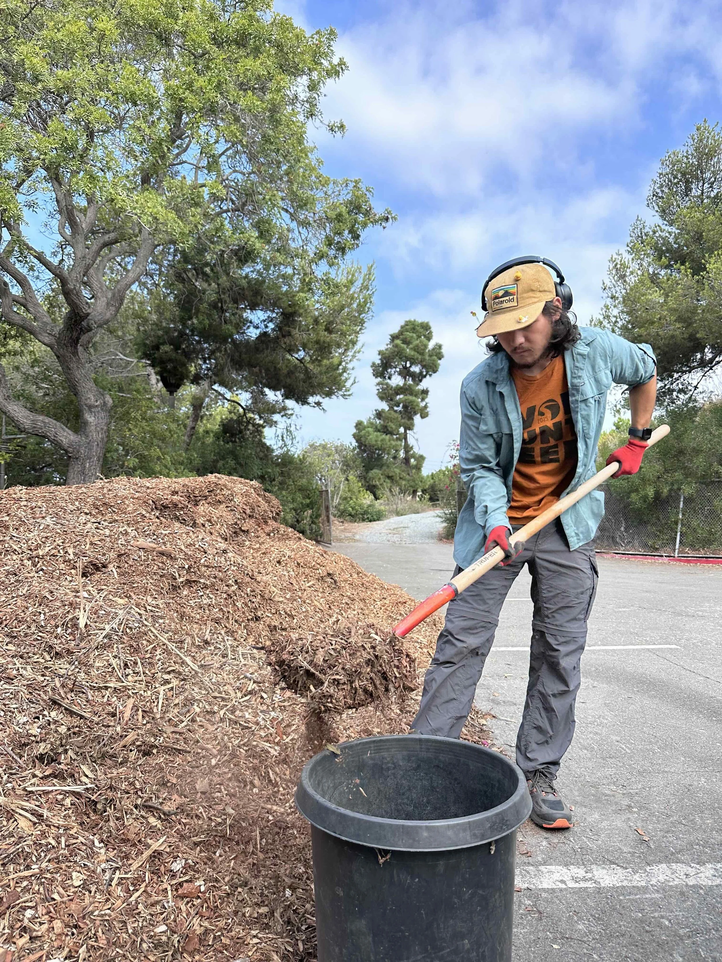 Nathan moving mulch.jpg