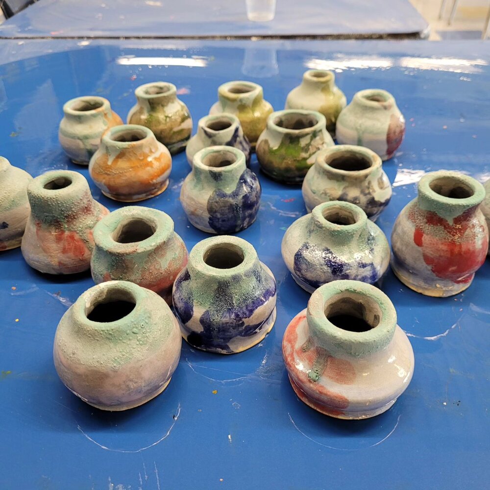 Happy Mother's Day!!! I had to keep these as a secret, but I was able to work with Avery's class with their Mothers Day projects this year. I made each vase on the wheel, and once they were fired each kid put a handprint on their project with glaze.