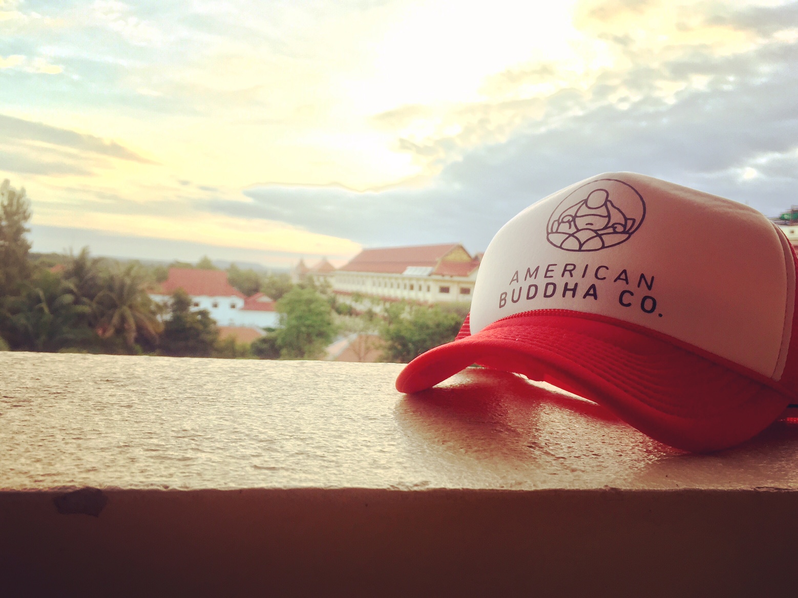American Buddha Co. Original trucker hat during sunrise at the Royal Angkor Resort.