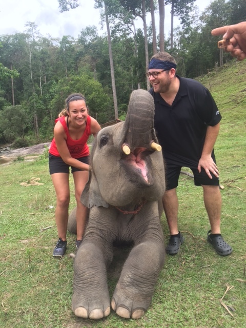 Ashlee and Adrian hanging out with the youngest of the elephant herd.