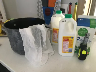 Step 1 Prepare the ingredients 2 bottles of buttermilk and a liter of milk, large pan, and cotton gauze. I usually get the buttermilk at Kroger.