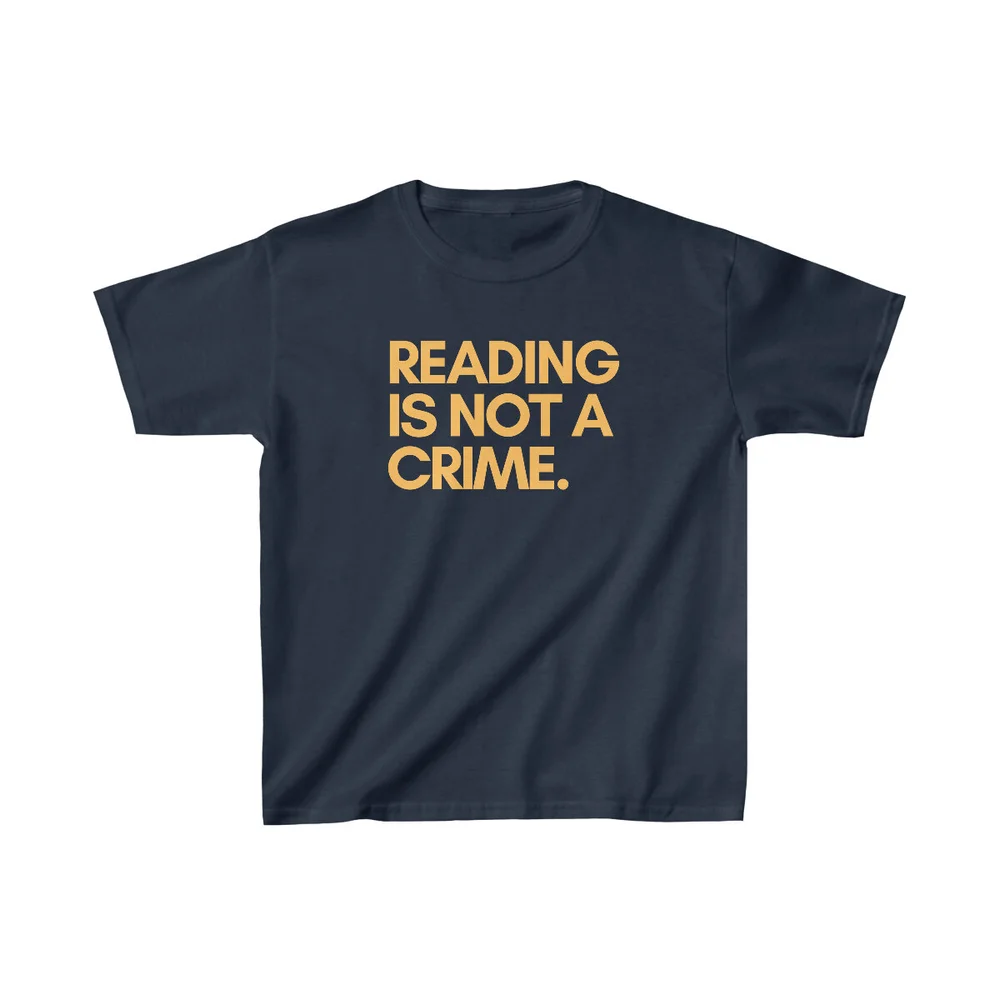READING IS NOT A CRIME Kids Tee (gold font) — Wiley Cash
