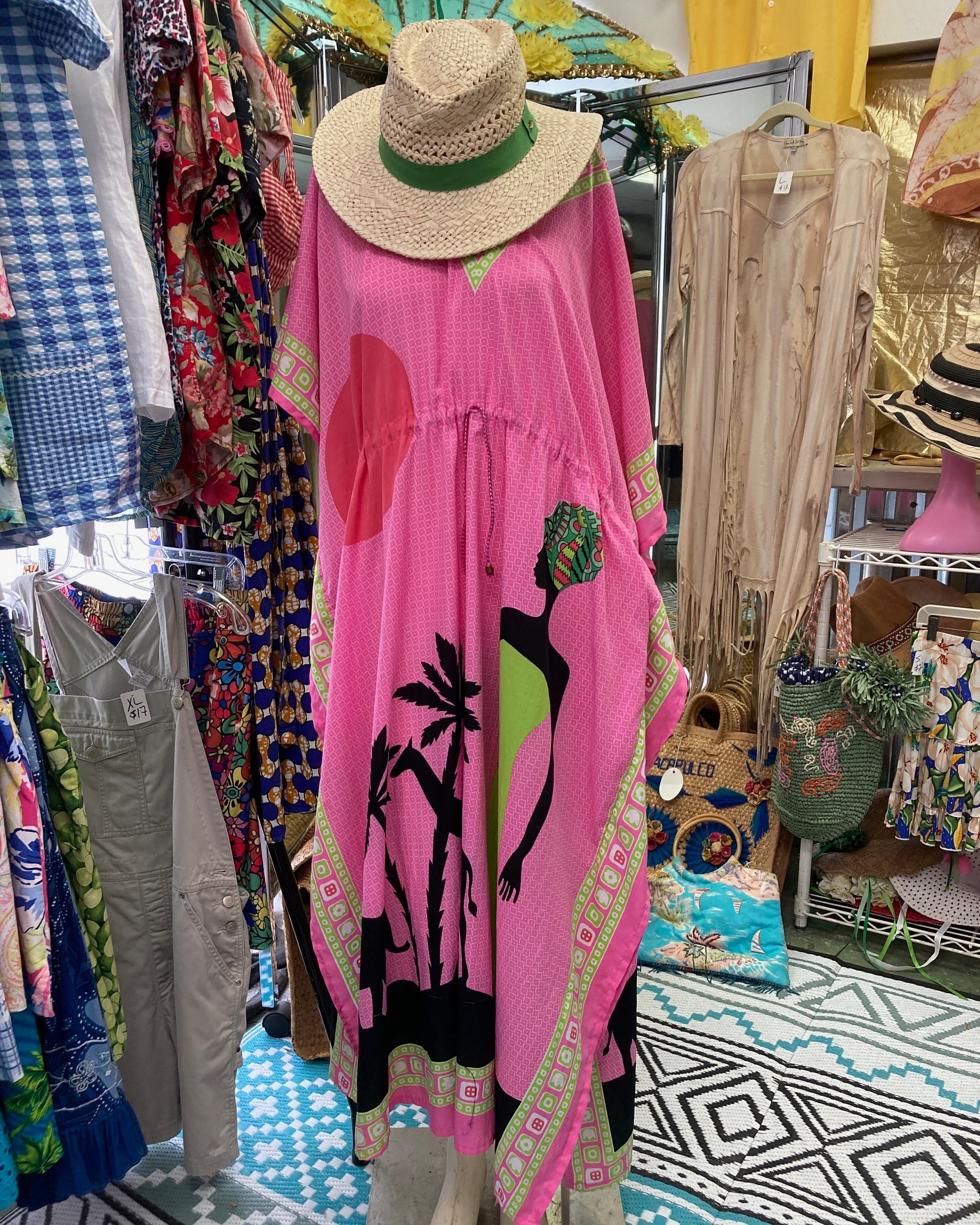 If you are looking to stand out, this caftan fits the bill. Bold in a beautiful pink with a gorgeous print design, pair it with a hat or maybe a dramatically tied head scarf and some chunky earrings. Find it at GinaWare this Friday and Saturday, 12-4