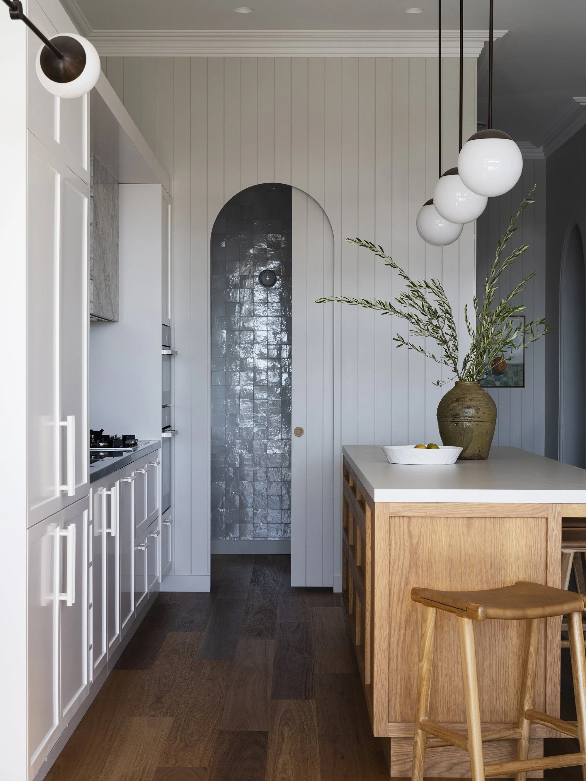 Custom Kitchen cabinetry, walk in pantry, white kitchen, american oak island, pendant lights, tongue and groove wall panels, morrocan tiles, zellij ktichen tiles