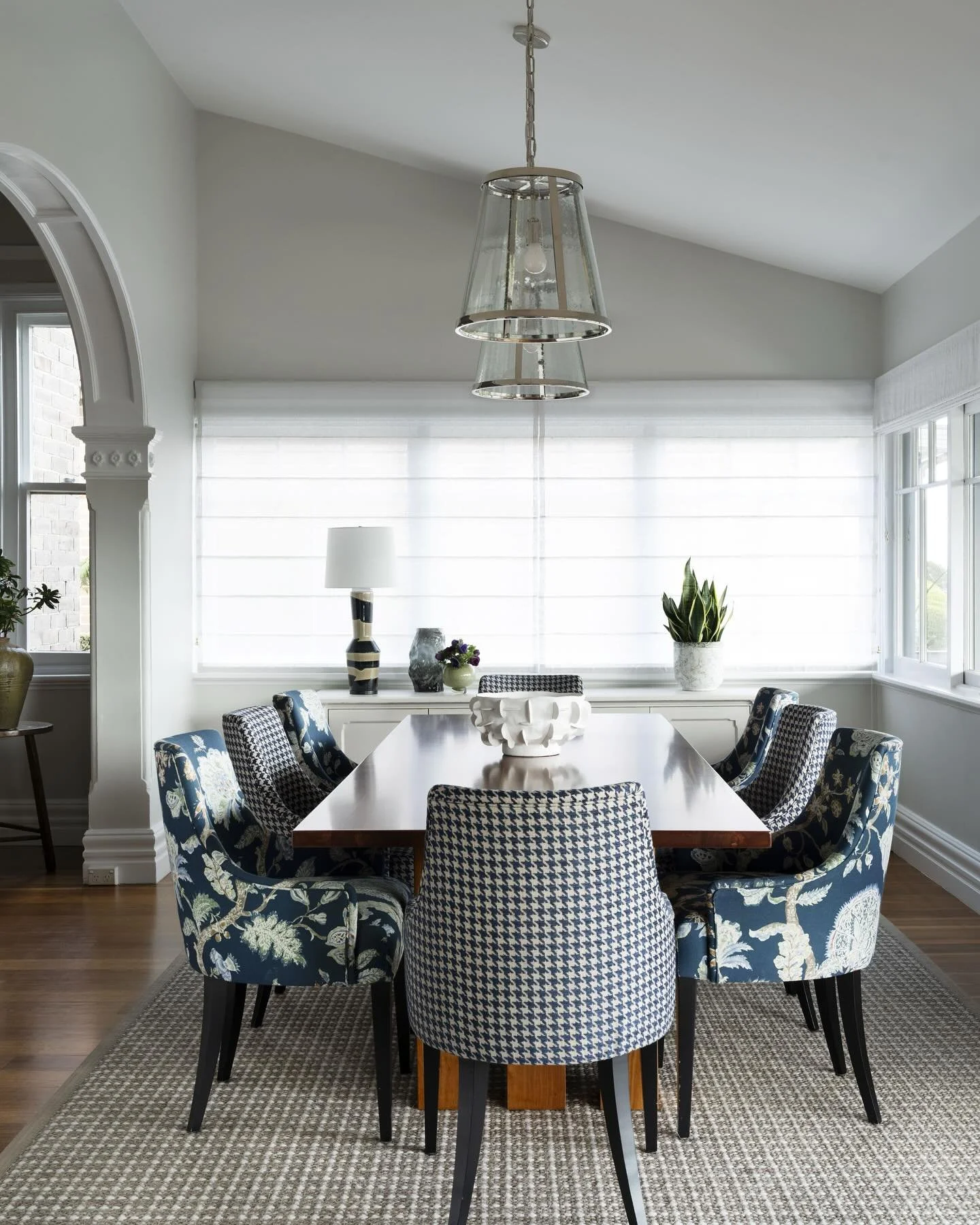 The dining room in our Prince Albert street project completed last year involved a re fresh of furnishings and adding of softening layers and colour. 

We recovered the dining chairs in two different fabrics: a houndstooth and floral which complement