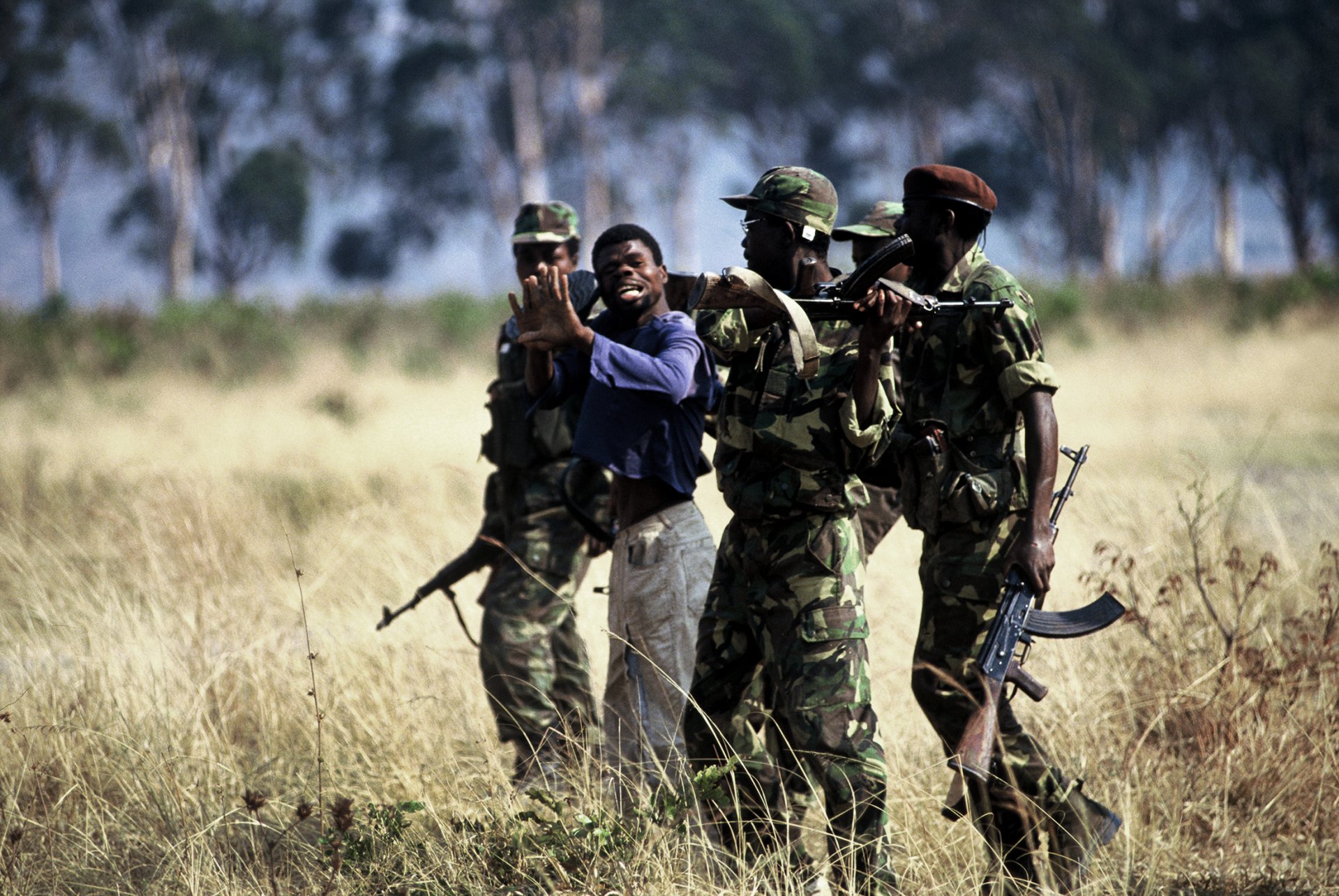  A young man is viciously beaten (he refused conscription) by MPLA soldiers during Angola's long-running civil war. 1993 