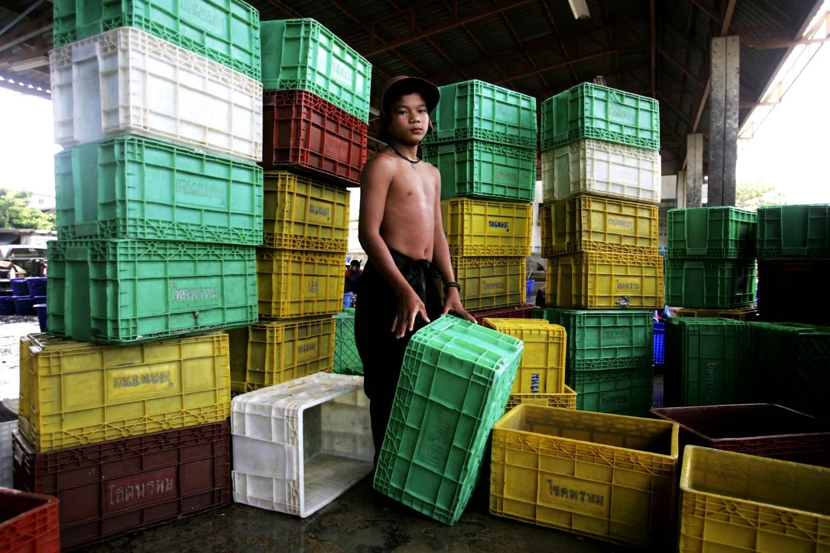 "Child laborer" Samut Sakorn fishing docks, Thailand. 2009