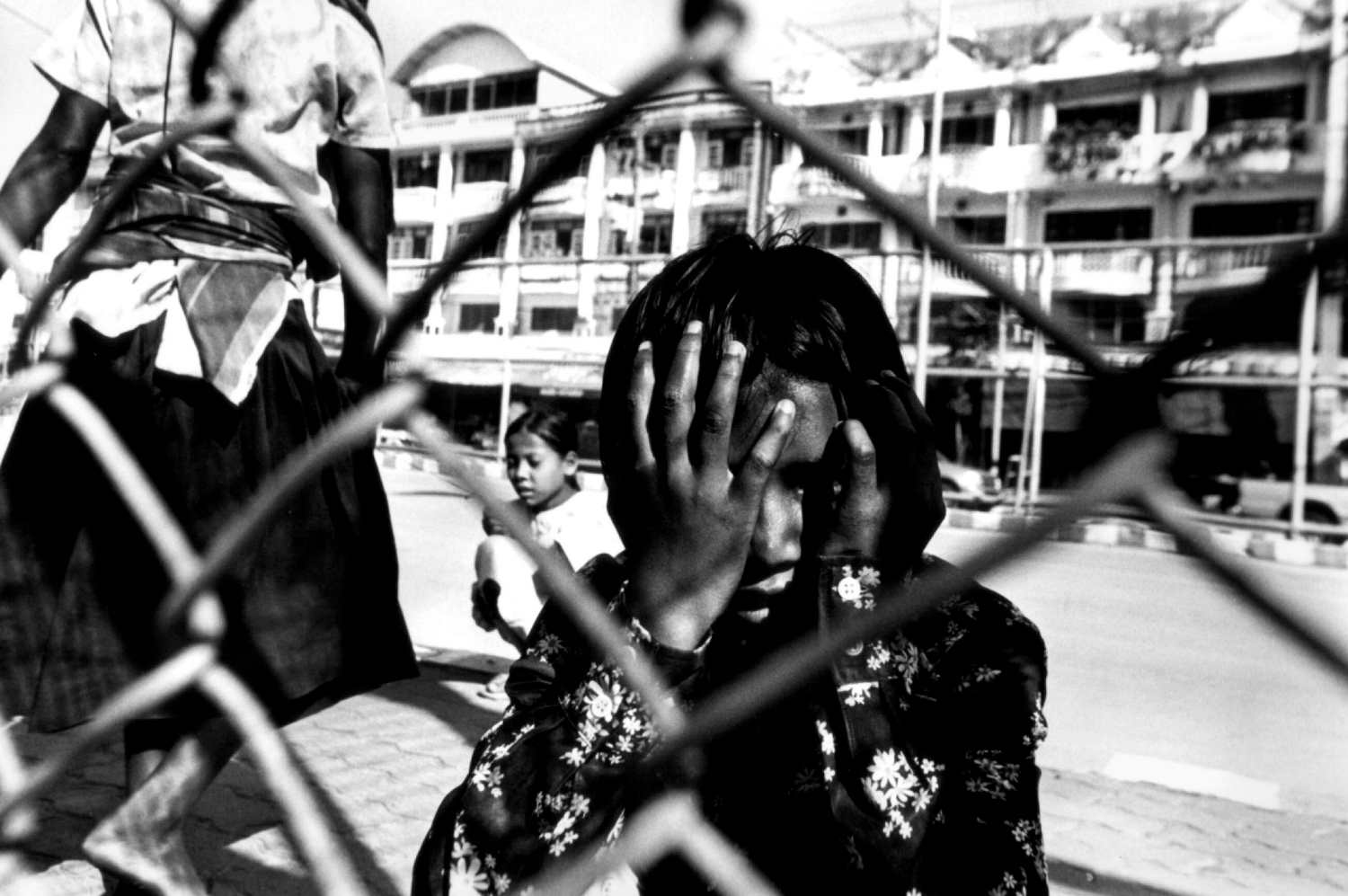  "Waiting for Work" Child porters on The Friendship Bridge Mae Sot, Thailand. 2004 