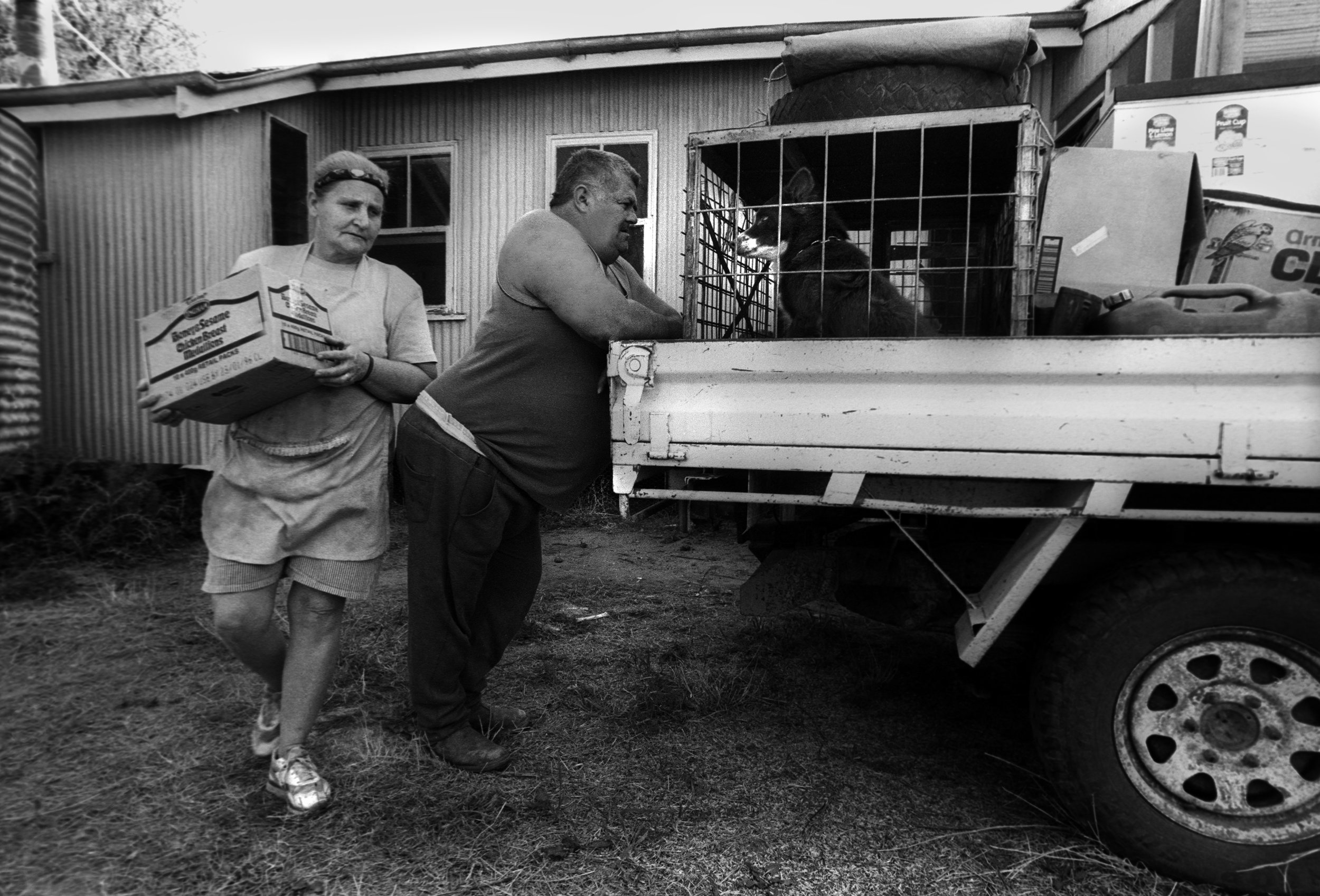  The shearer’s cook and her husband pack the ‘ute’ (utility truck) before travelling to the next sheep station. Outback QLD, Australia. 1997 