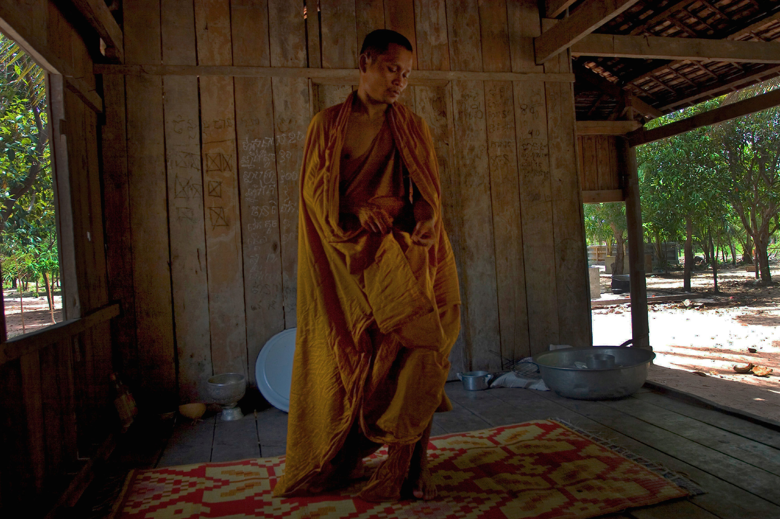  A Buddhist Monk suffering from Malaria awakes from a fitful sleep. Siem Reap district Cambodia. 2010 