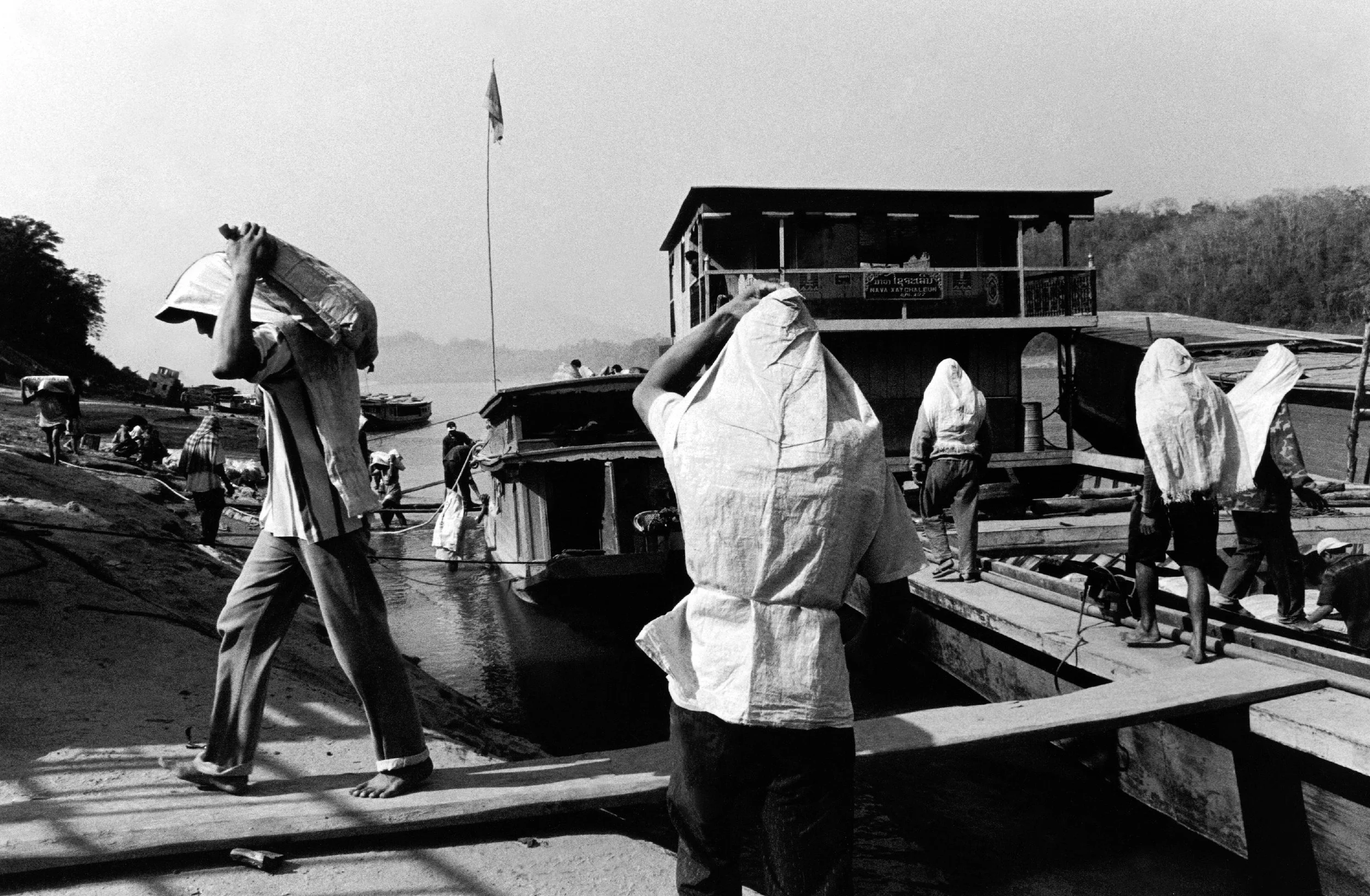  Unloading cargo. Luang Prabang, Laos. 2005 