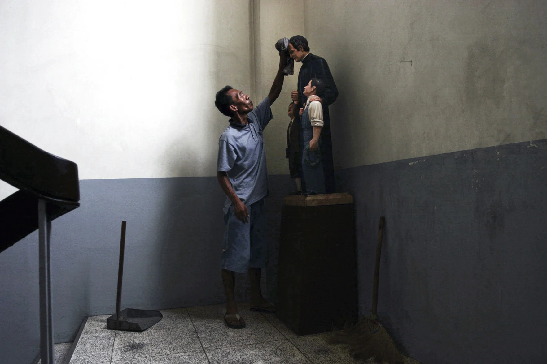 Janitor at work. Catholic school in Tondo slum metro Manila. 2005