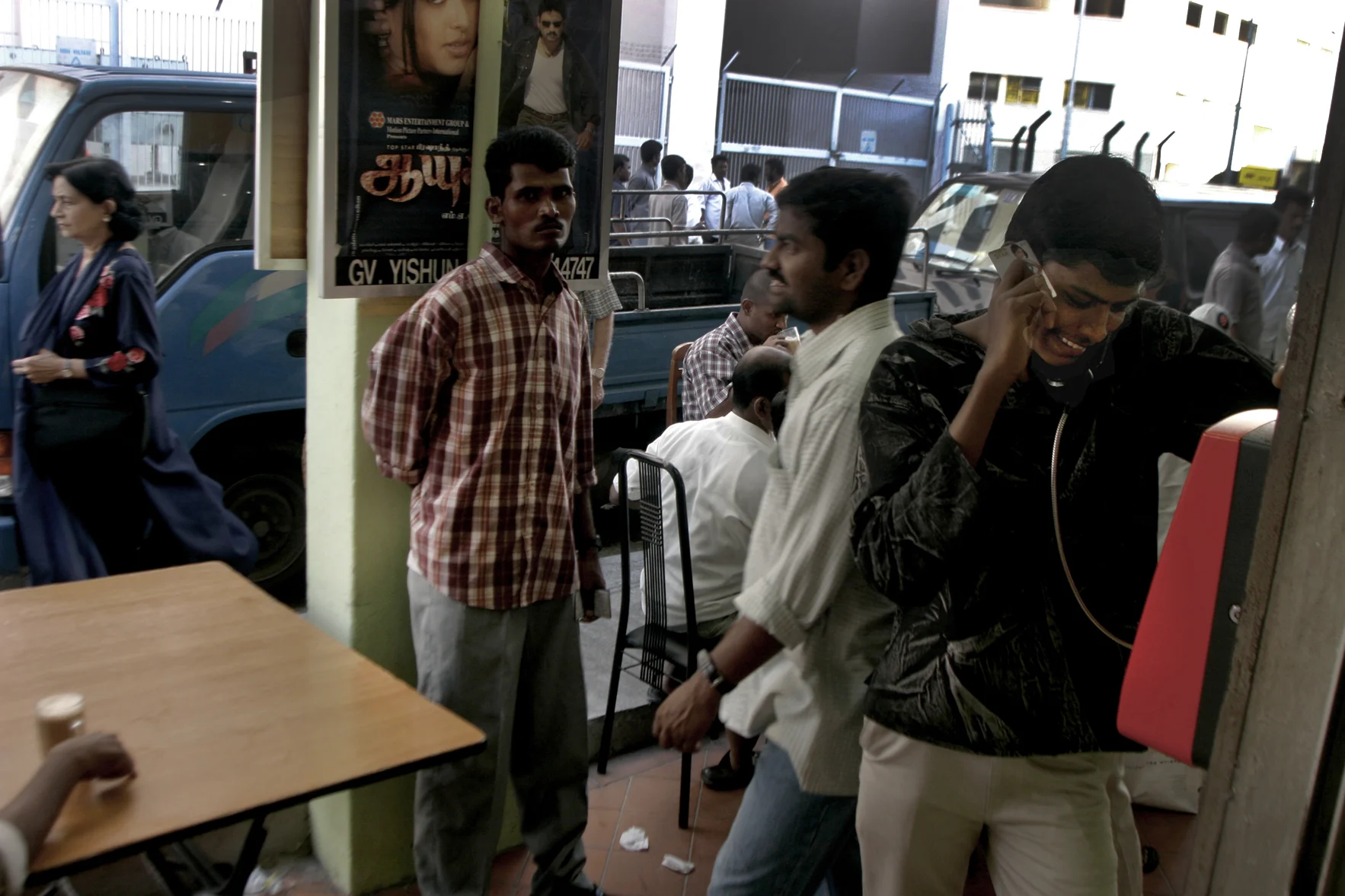 Immigrant workers call home. Singapore, 2005