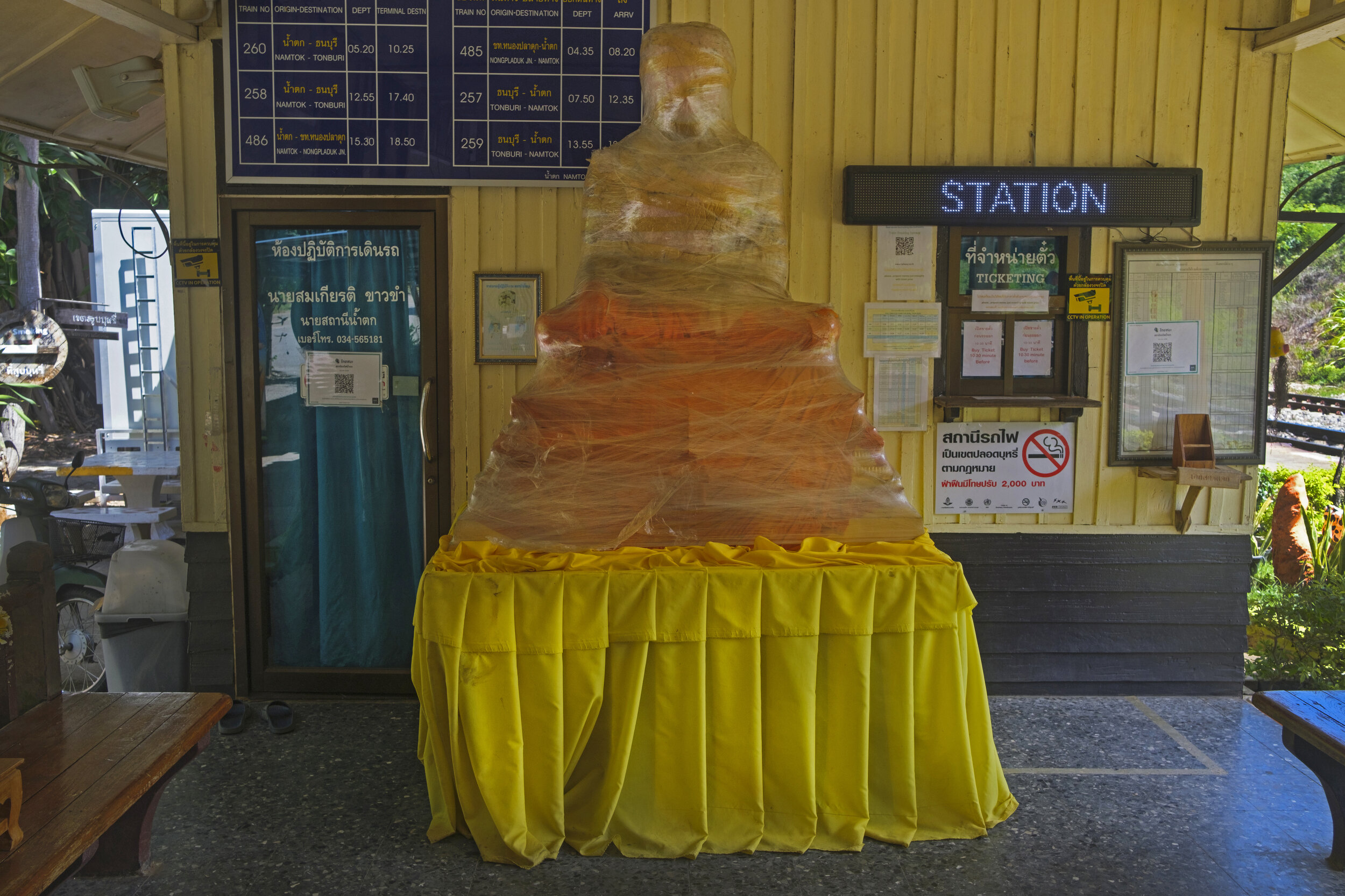  Nam Tok terminal station [complete with Buddha statue wrapped in cellophane] on the Bangkok Thonburi to Nam Tok line. 