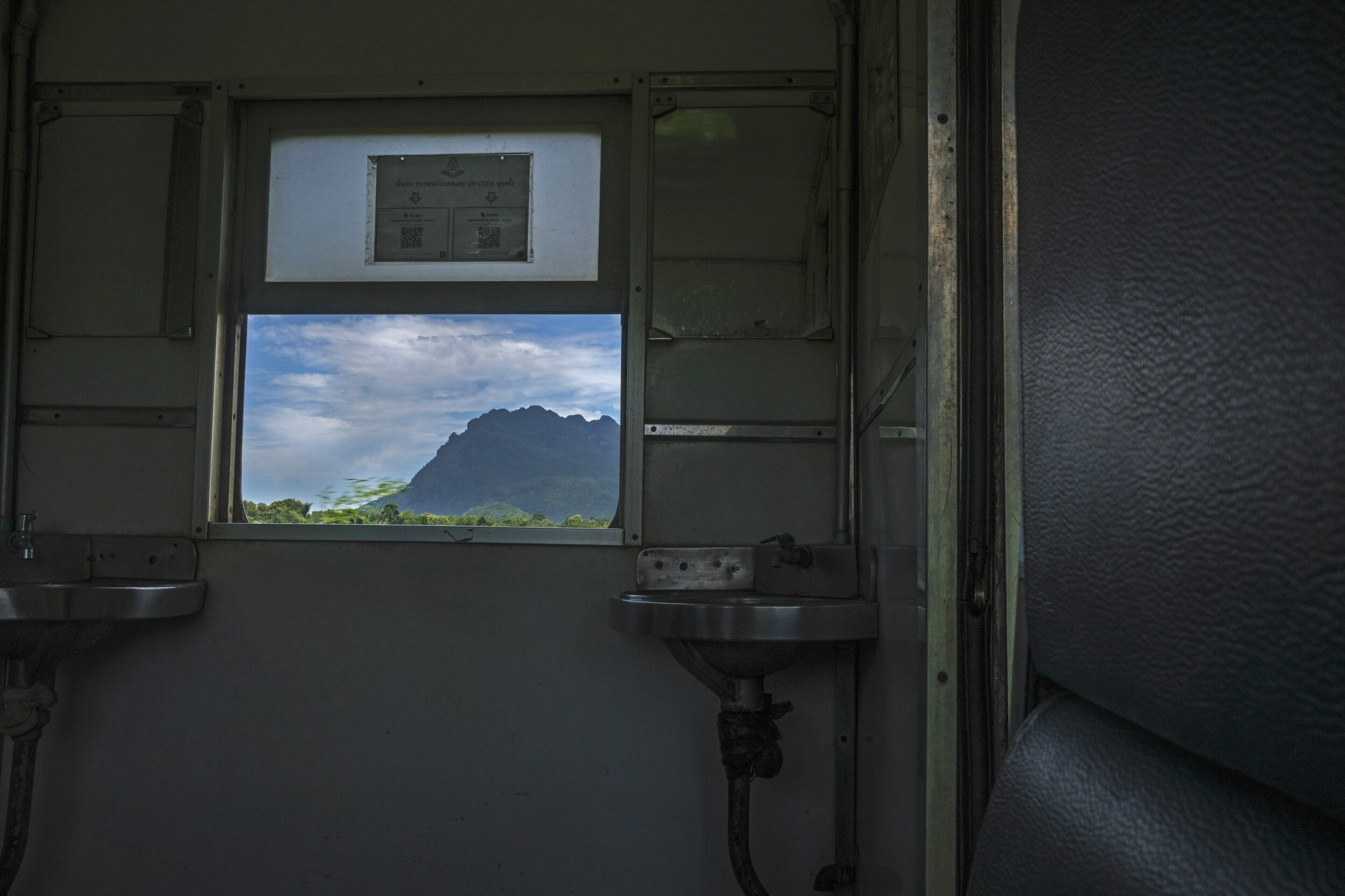  Window vignettes on the journey along the infamous ‘death railway’ built by Allied prisoners during World War II. 