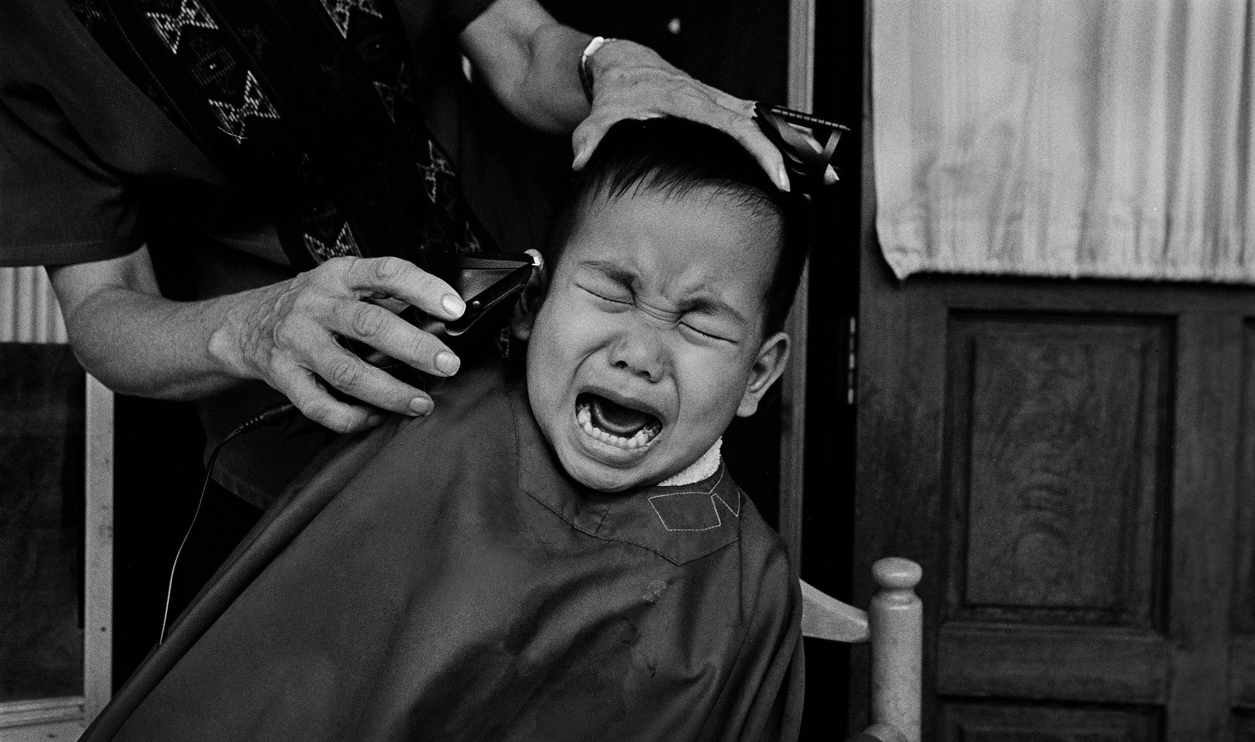  "Hair Cut" At the Agape orphanage for those living with HIV. Chiang Mai, Thailand. The mid-1990s. 