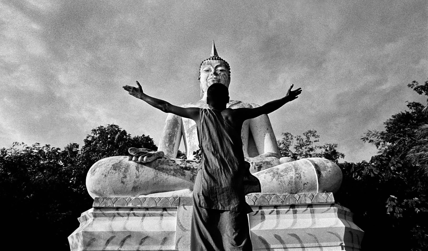  An HIV+ Monk prays to Buddha. Lopburi, Thailand. 2003 