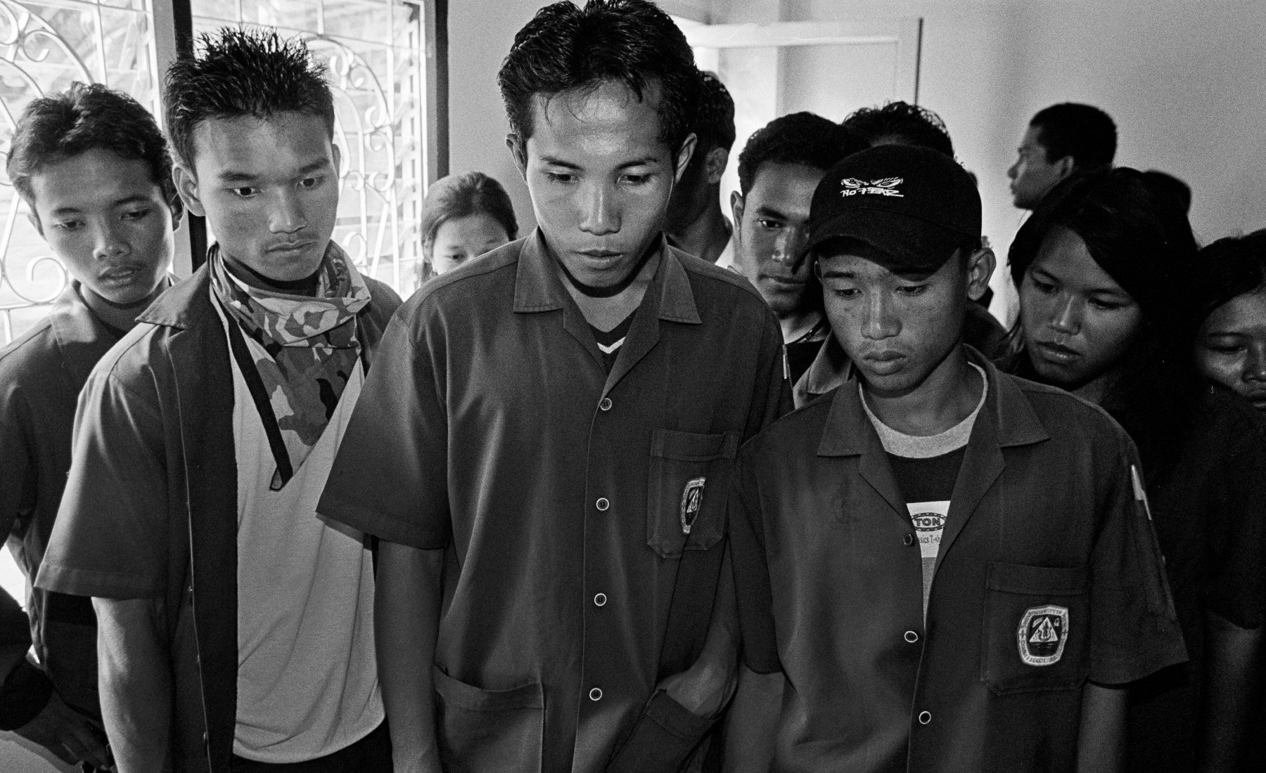  Students view a deceased woman exhibited at the Wat Prabat Nampu AIDS Museum in Lopburi, north of Bangkok. Thailand. 2003.  