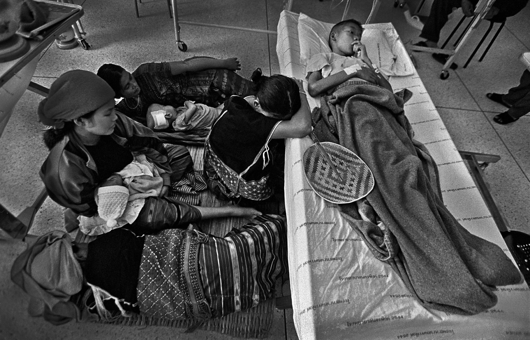  “Family Support” Extended family support for a young boy treated for HIV at a local hospital north of Chiangmai in provincial Thailand. The mid-1990s. 