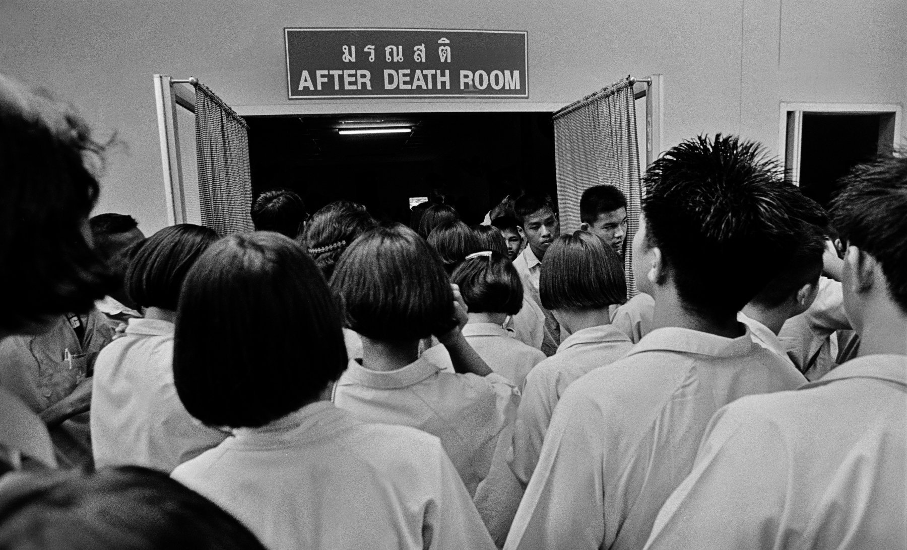  “After Death Room” Students visiting the Wat Prabat Nampu AIDS Museum in Lopburi, north of Bangkok. Thailand. 2005.  