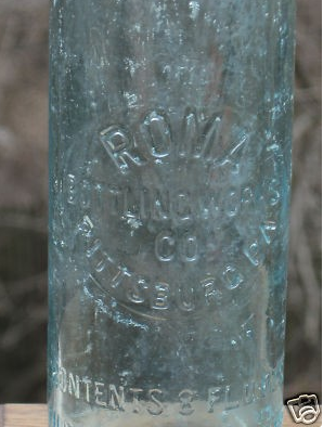 Early Roma Embossed Bottle