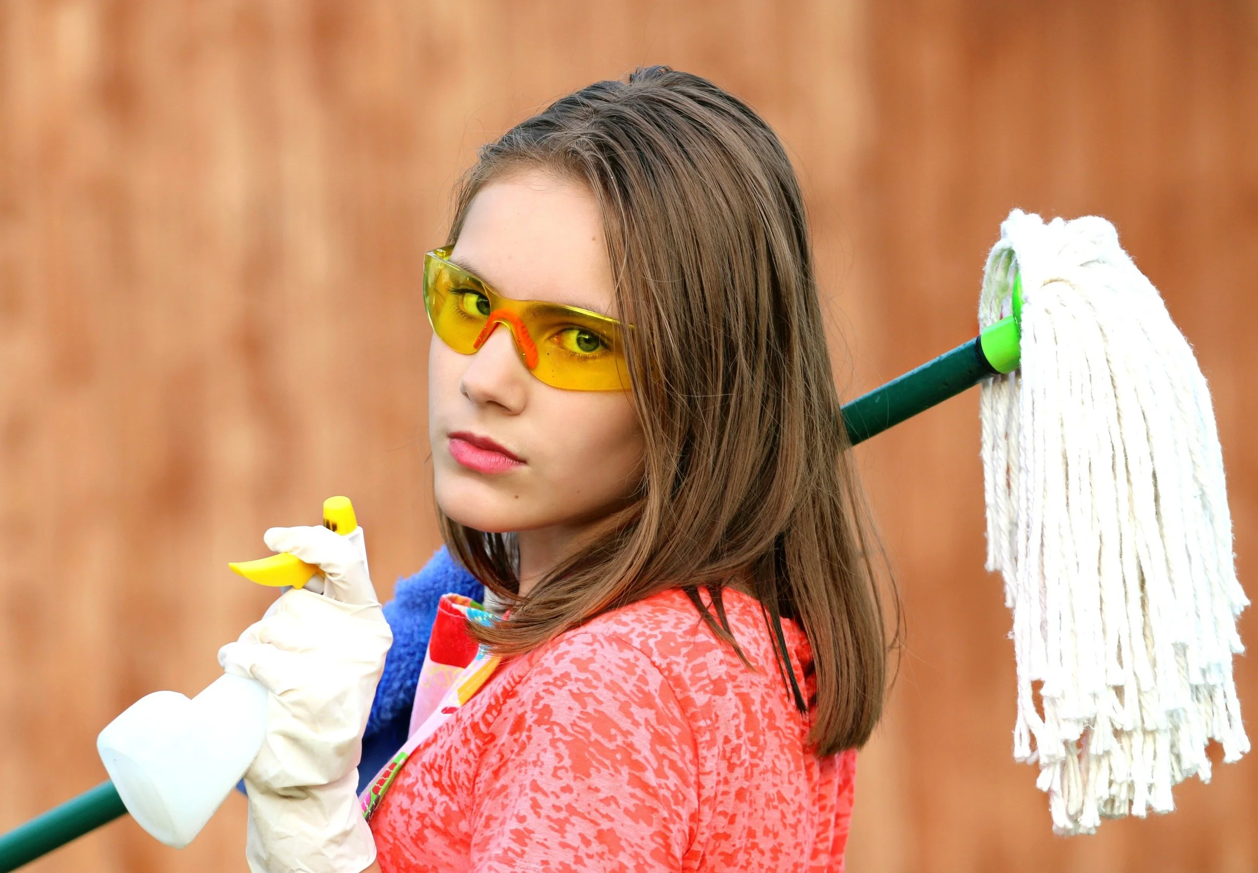 Young person with cleaning equipment