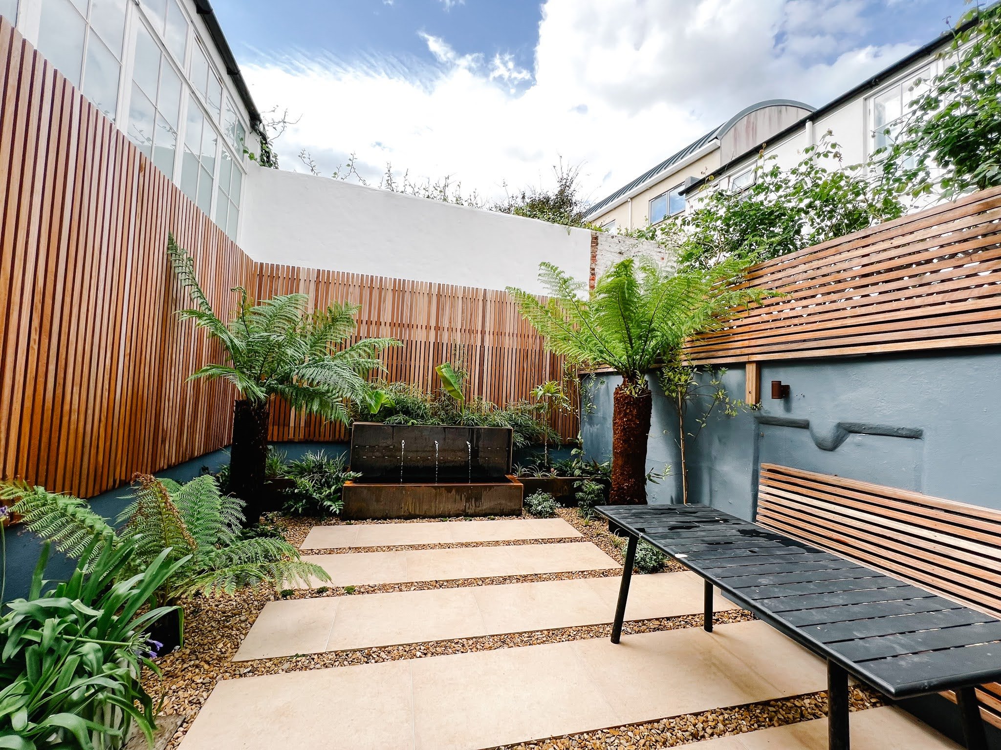 tropical courtyard garden design. landscapers sussex