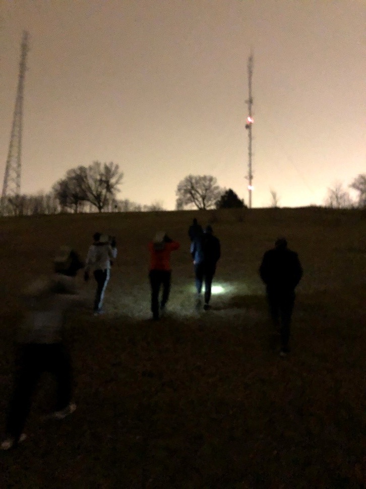 The PAX carry their coupons up the hill at Belknap Park during Kraut’s workout entitled ‘Ruck Yeah’