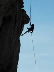 (photo of one of our high school students rappelling in Colorado in 2017)