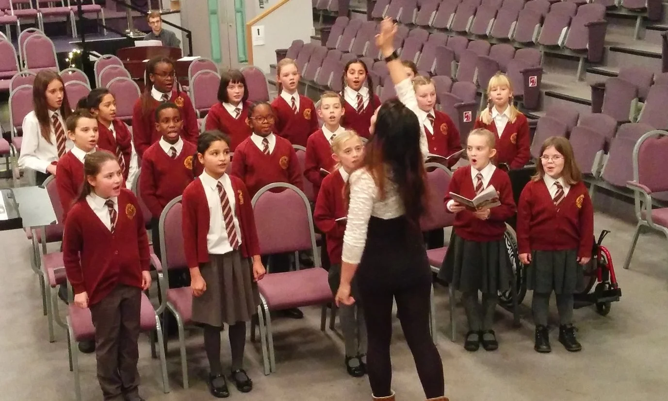Singers from Springhil school rehearsing for their performance at Central Hall