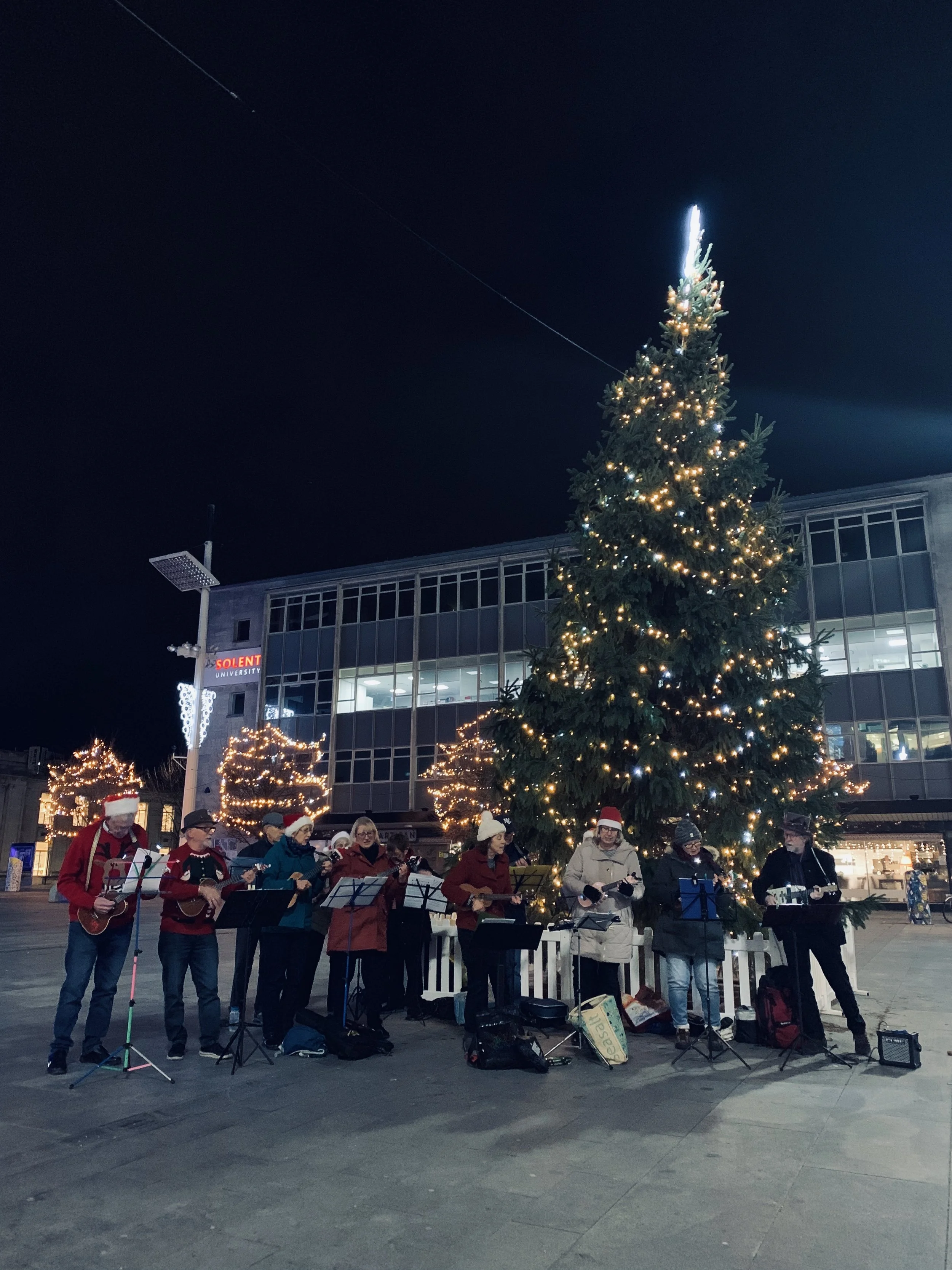Festive feelings come to Guildhall Square as Sholing Ukuleles rock around the Christmas Tree