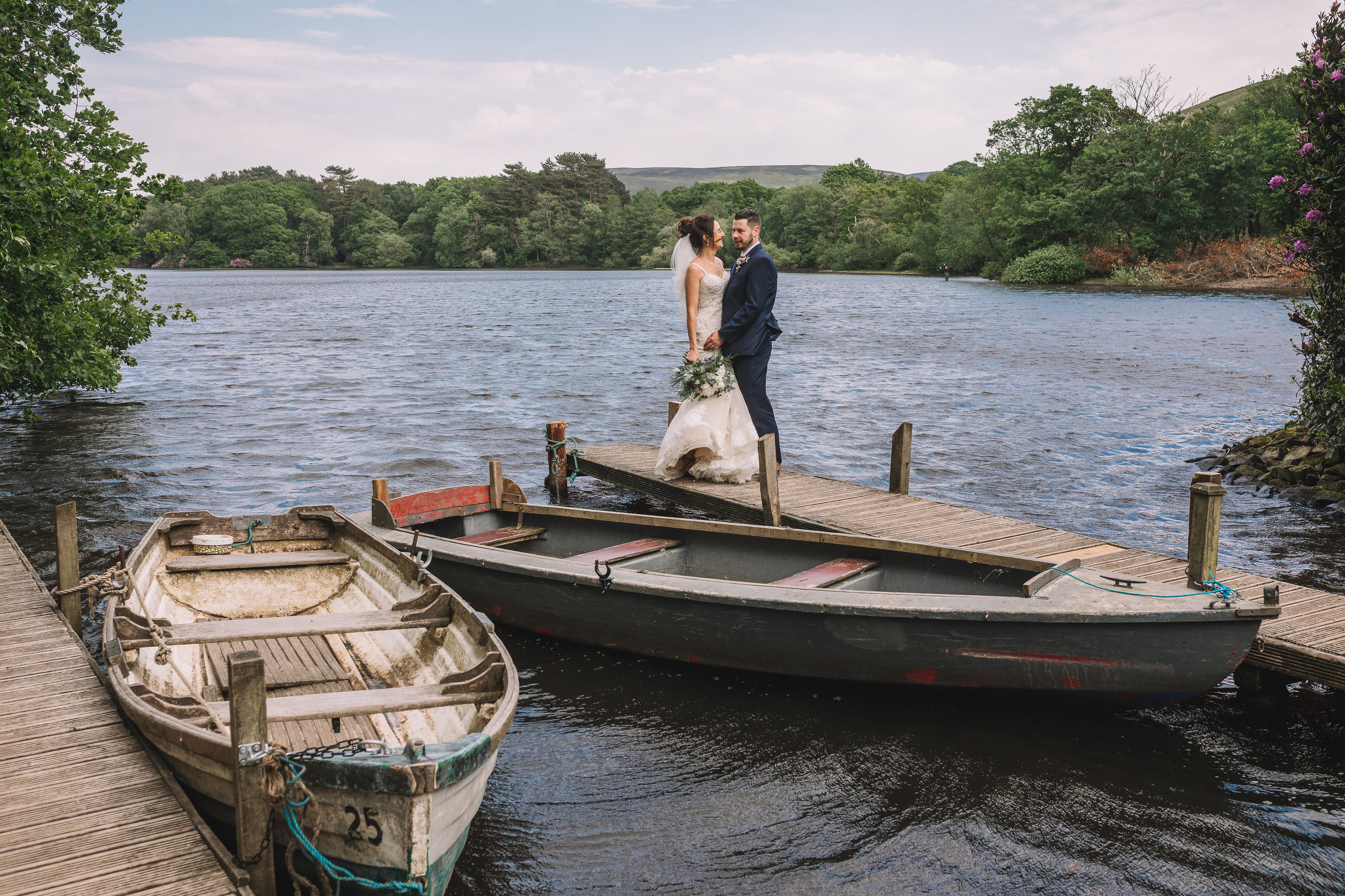 Boating lake wedding kiss