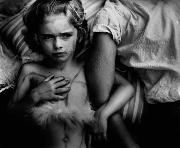 “Jessie Bites” (1985) one of the many powerful moments captured by Sally Mann of her family. To be fair, however, Mann’s photos are not true “small moments” but fictional accounts of small moments; she works in large format and prepares her shots carefully. For me, still, they inspired a lot of small-moment photography.
