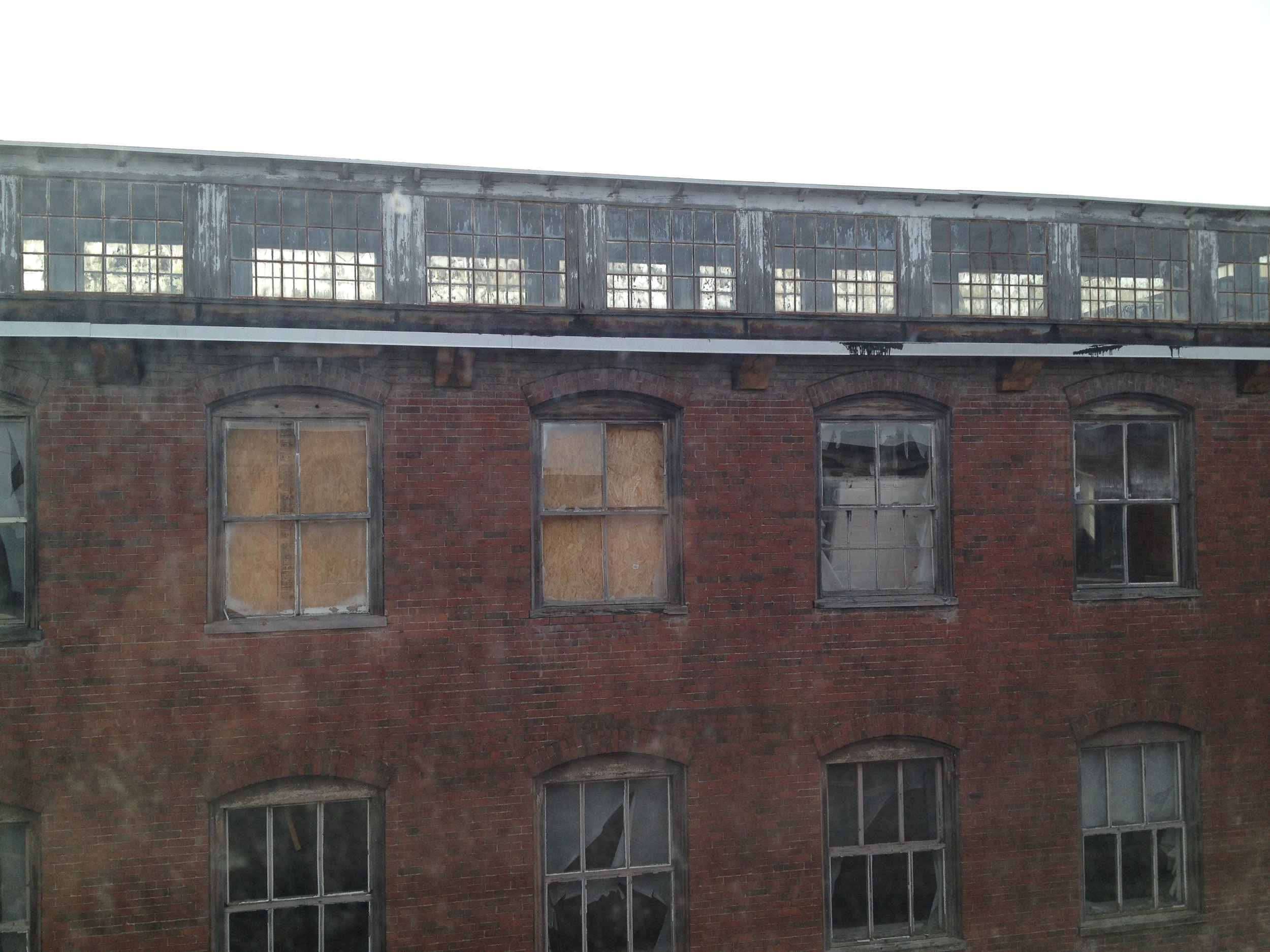 Broken windows and rotting wood frames.JPG
